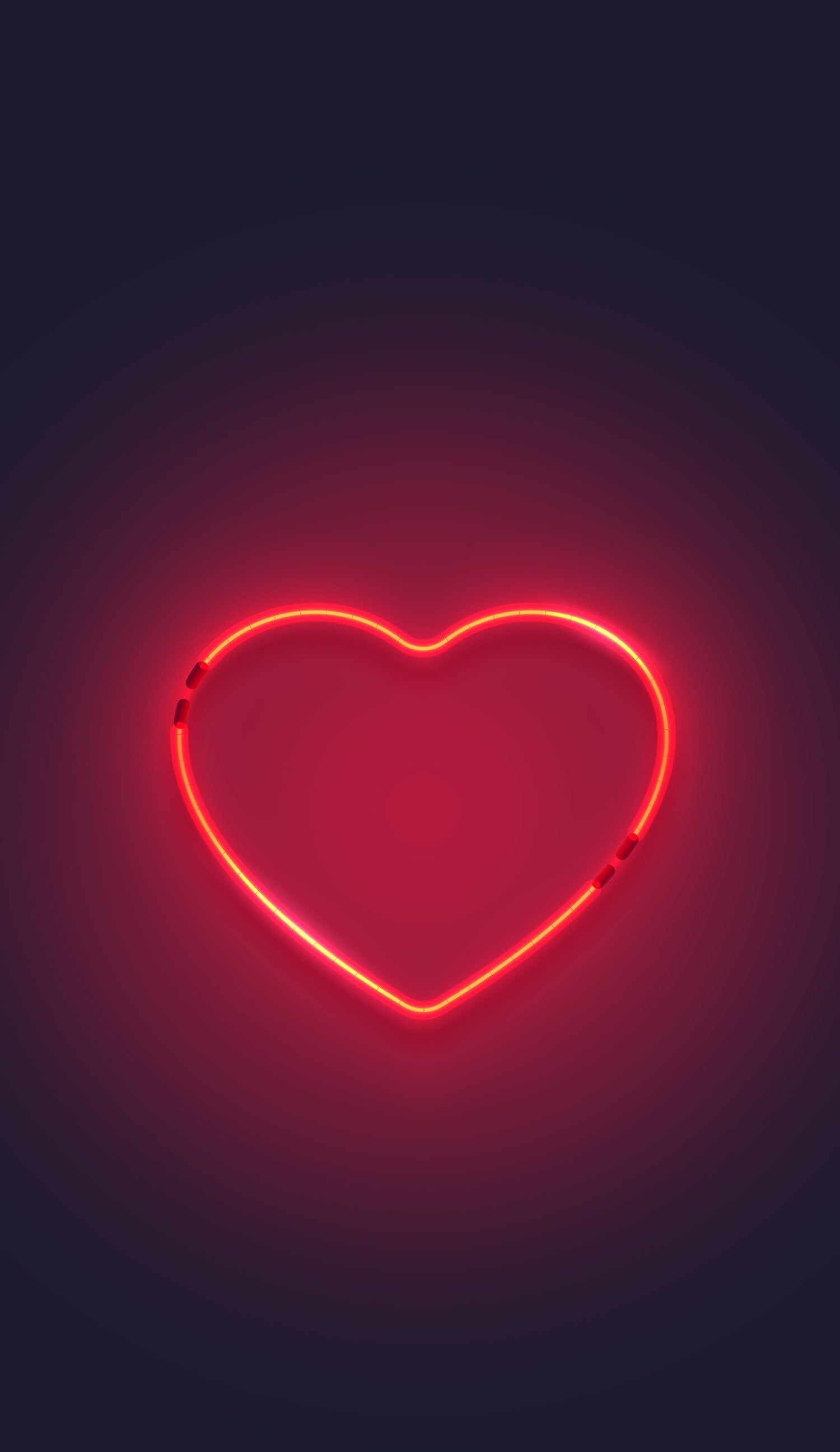 A red neon heart on a black background - Neon orange