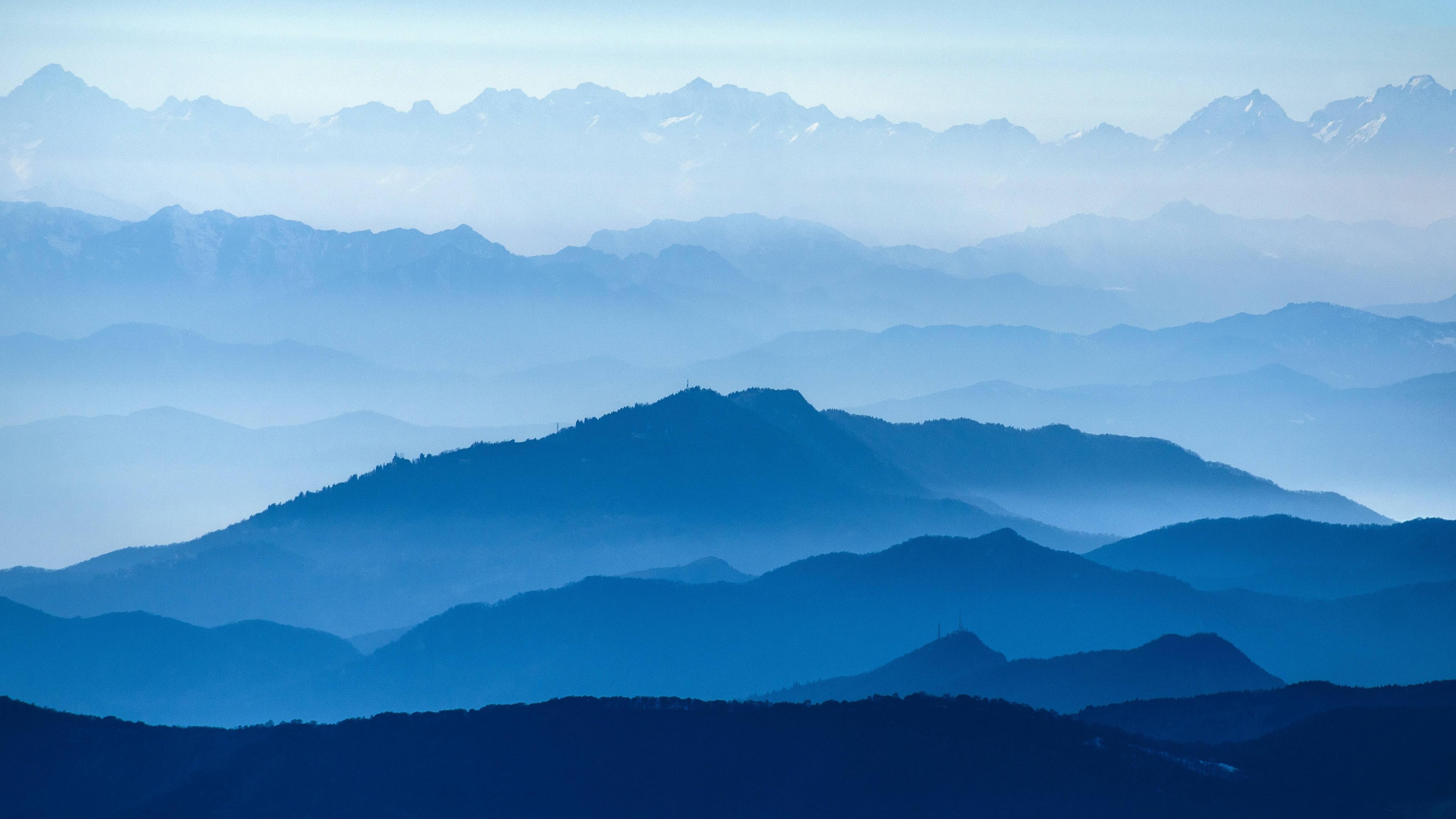 A photo of a mountain range in blue hues. - Mountain