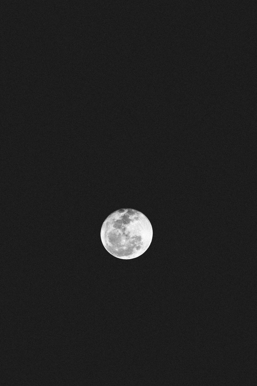 A full moon in a black sky - Black