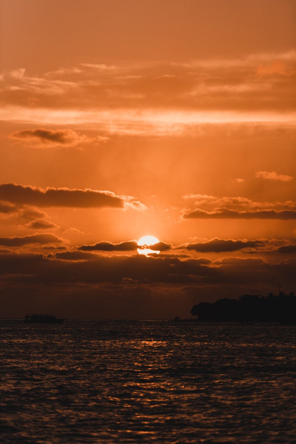 The sun setting over the sea - Sun
