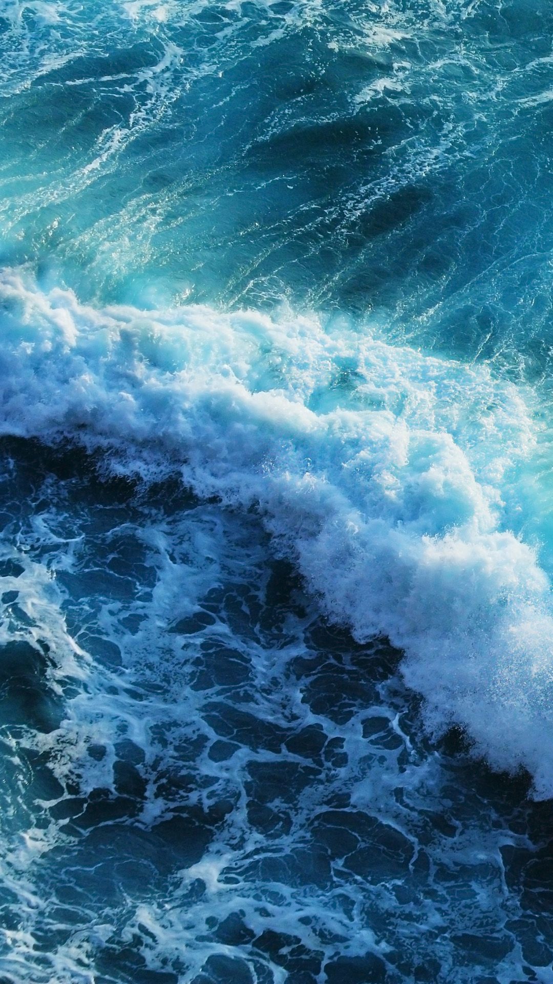 Aerial view of a large wave in the ocean - Wave
