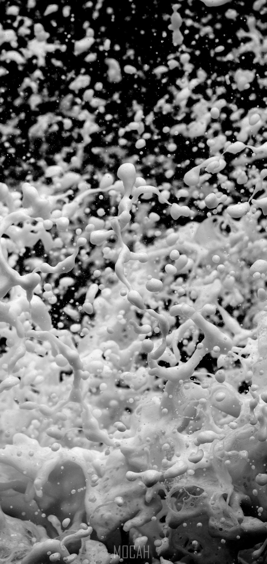 A black and white photo of water splashing - Wave