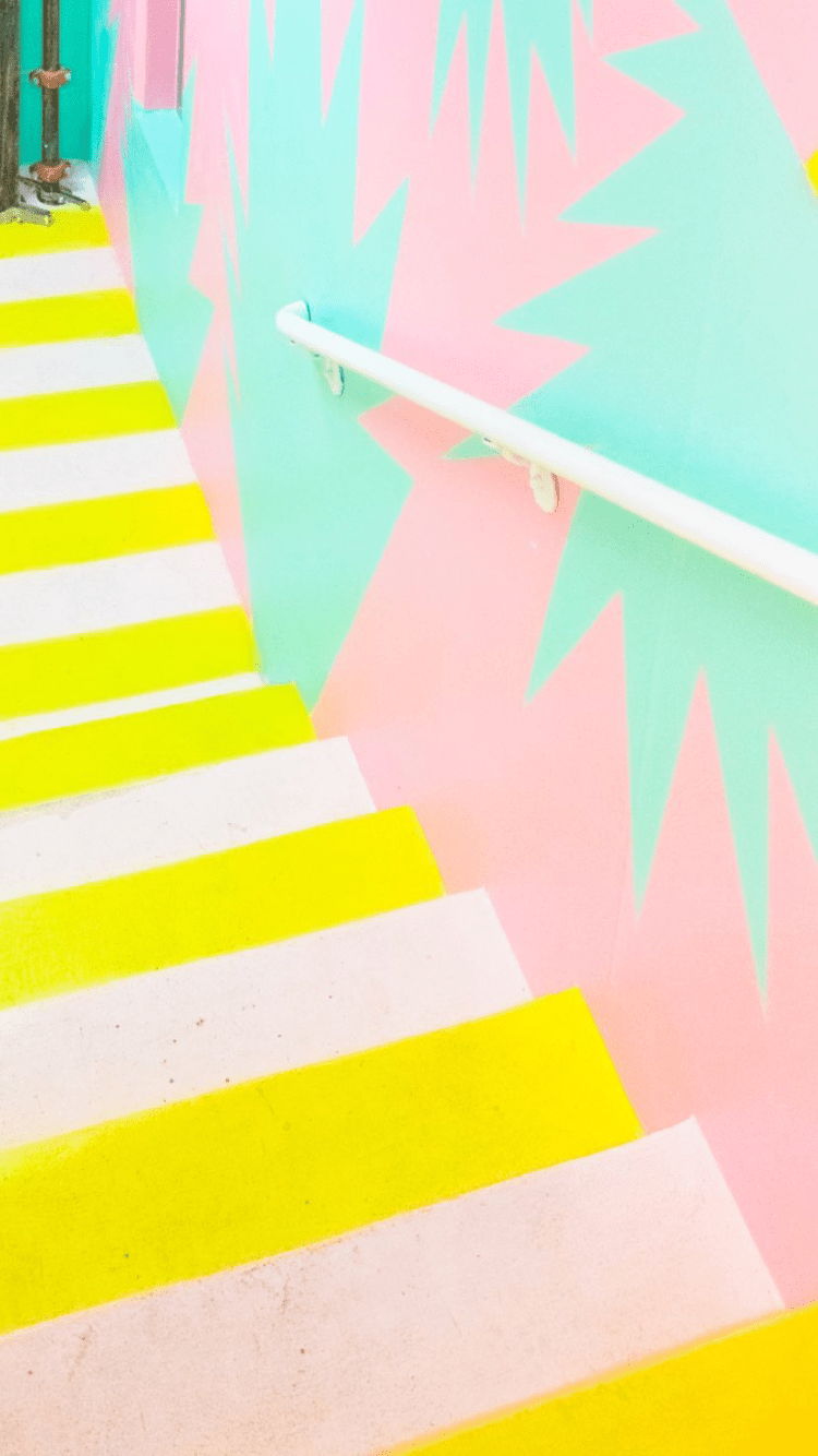 A yellow and pink staircase with white stripes - Bright