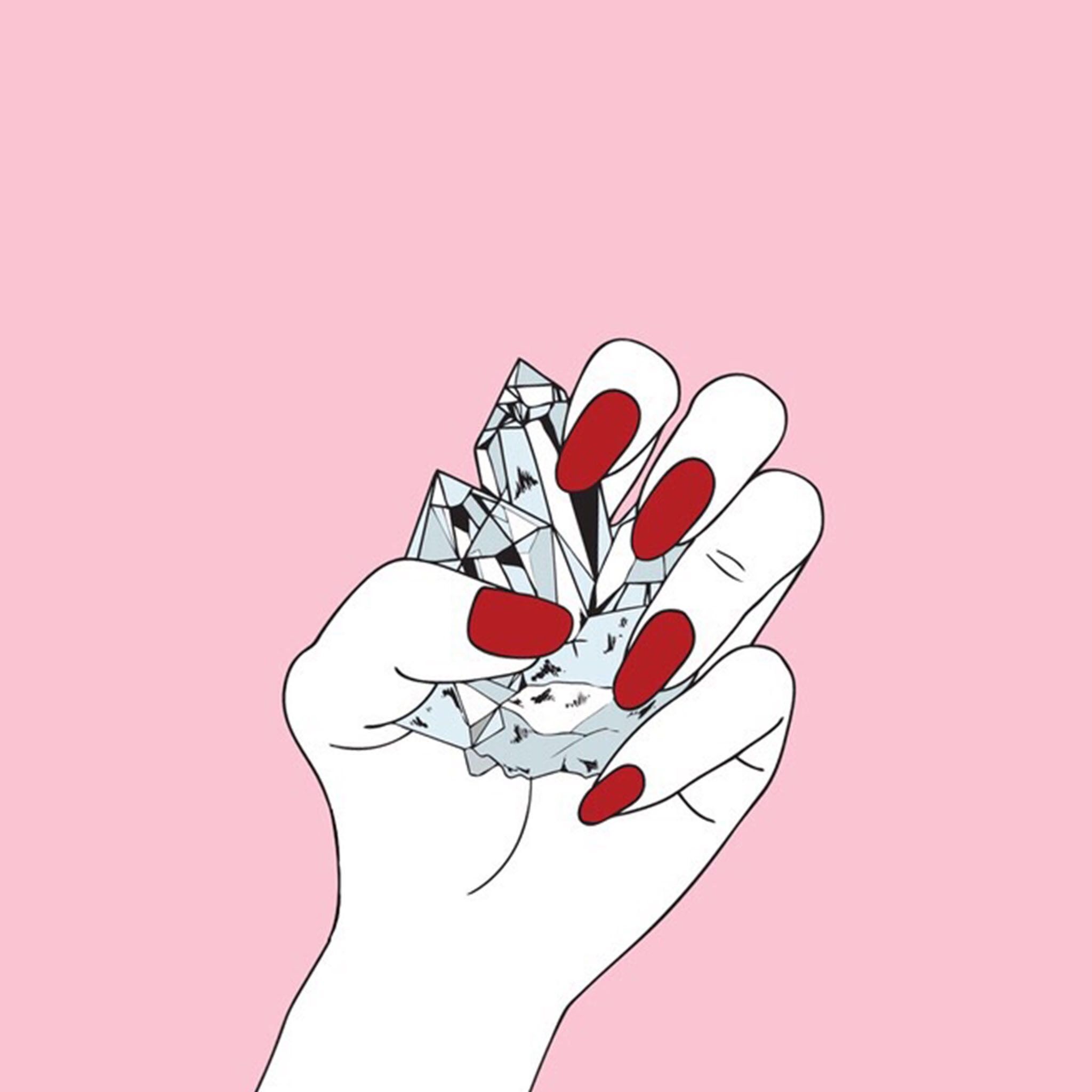 A hand with red painted nails holding a diamond. - Nails