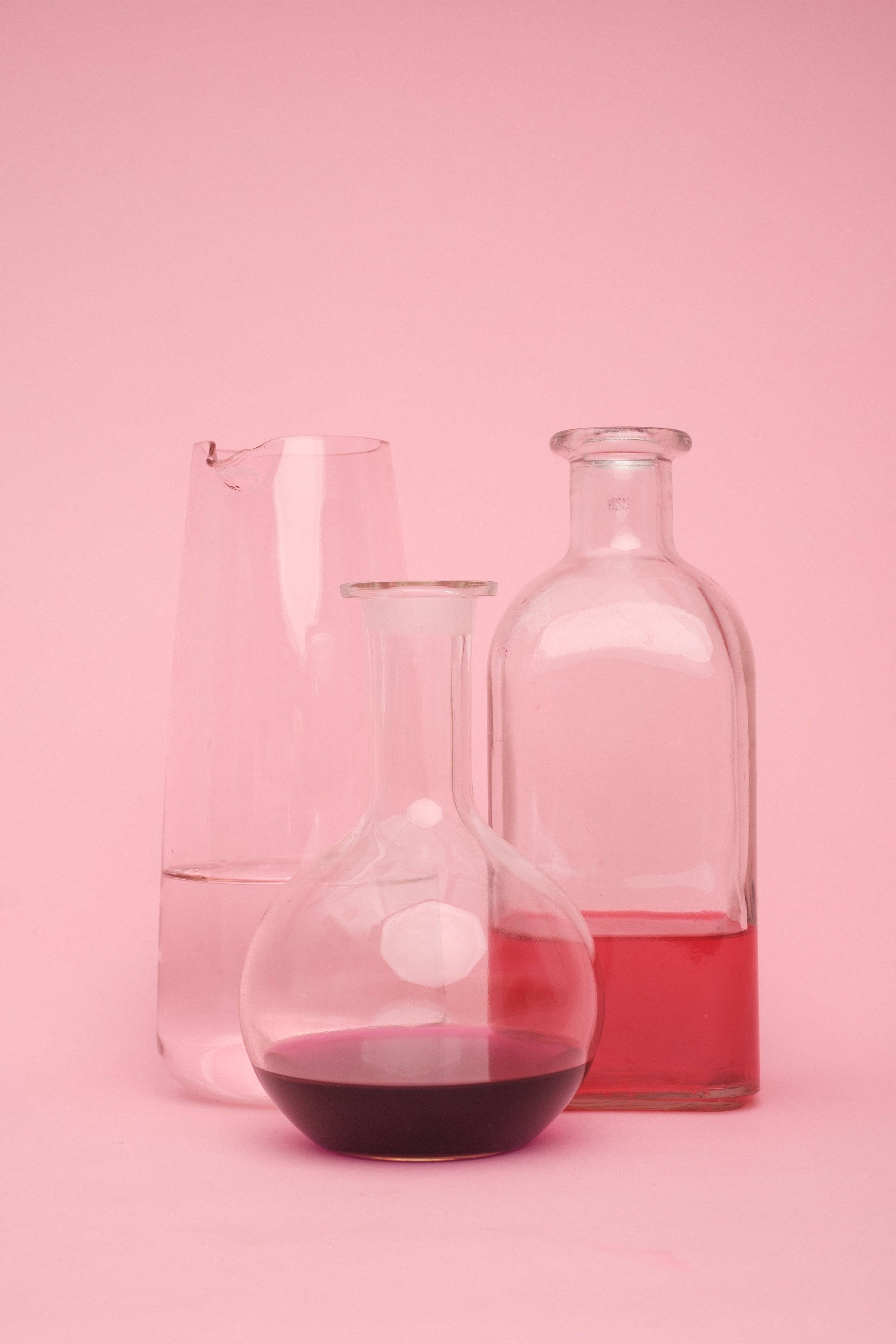 A couple of glasses and bottles on pink - Chemistry