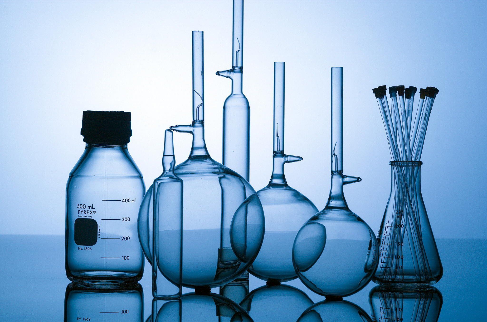 A collection of laboratory glassware including bottles and beakers - Chemistry