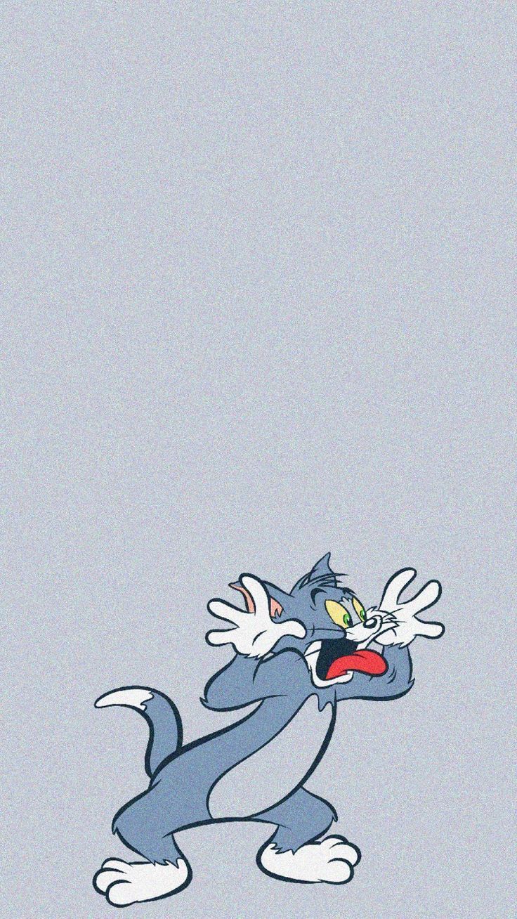 A cartoon cat is standing on its hind legs - Tom and Jerry