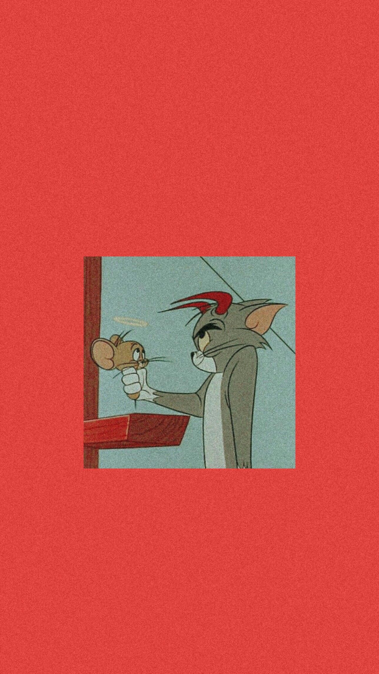 A cartoon mouse is holding something in his hand - Tom and Jerry