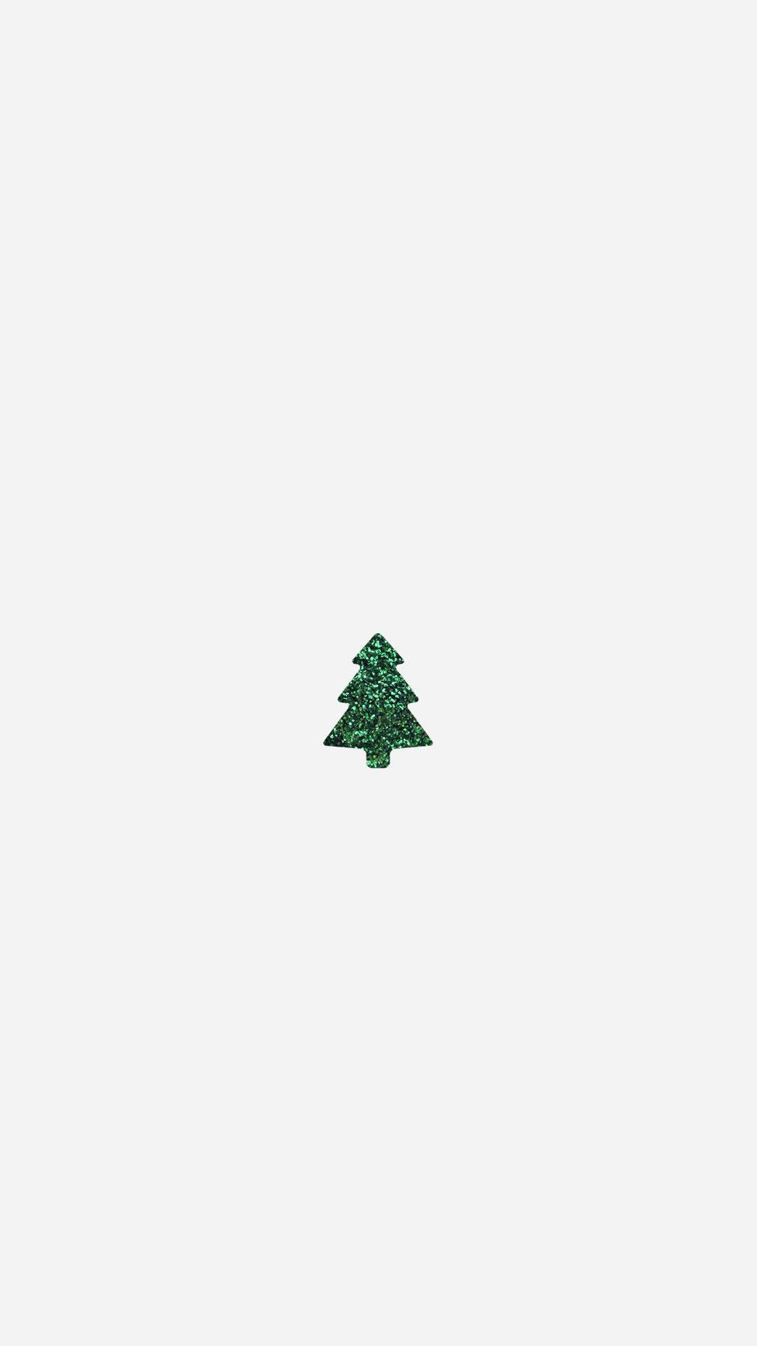 A small green christmas tree on white background - White Christmas