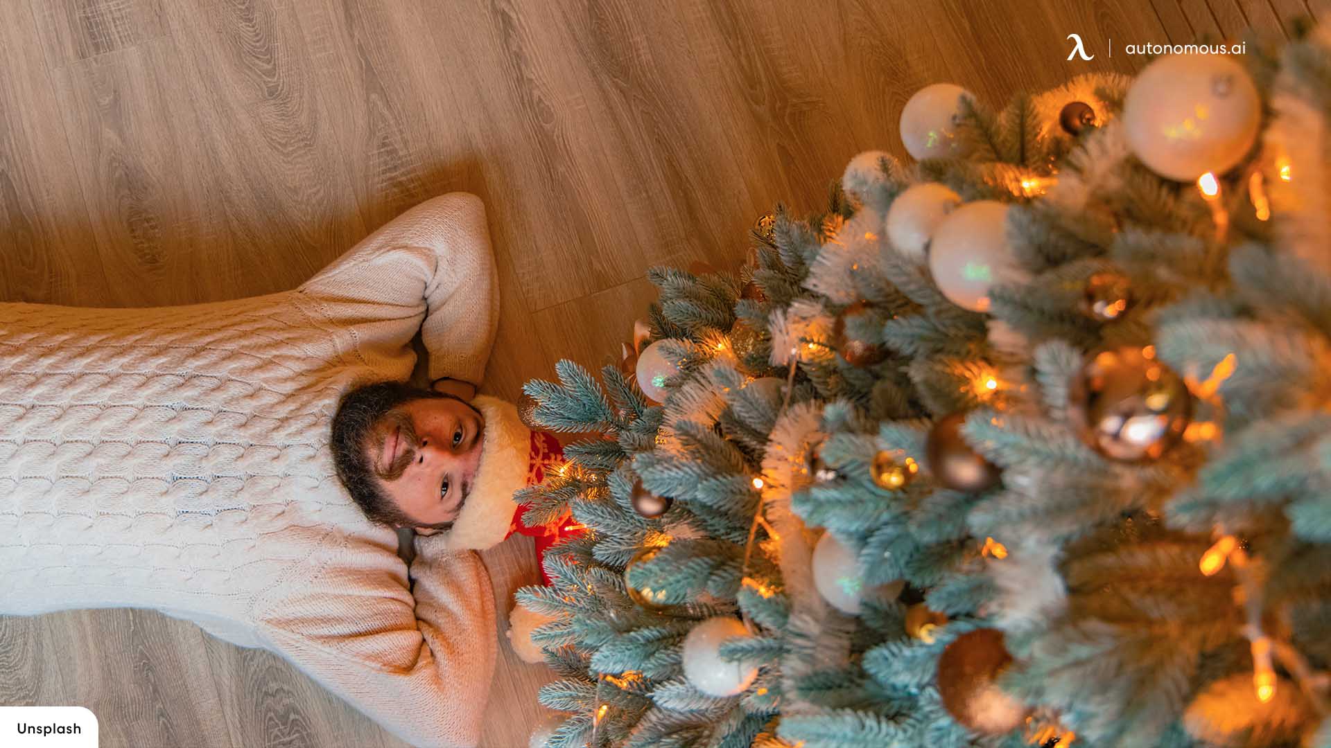 A man lying on the floor next to a Christmas tree - White Christmas, cute Christmas, Christmas