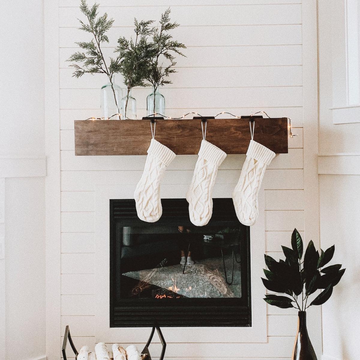 Stockings hung above a fireplace. - White Christmas
