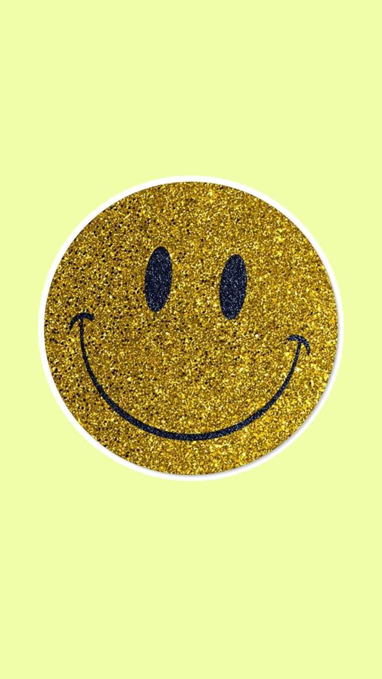 A gold smiley face with black eyes on yellow background - Smile