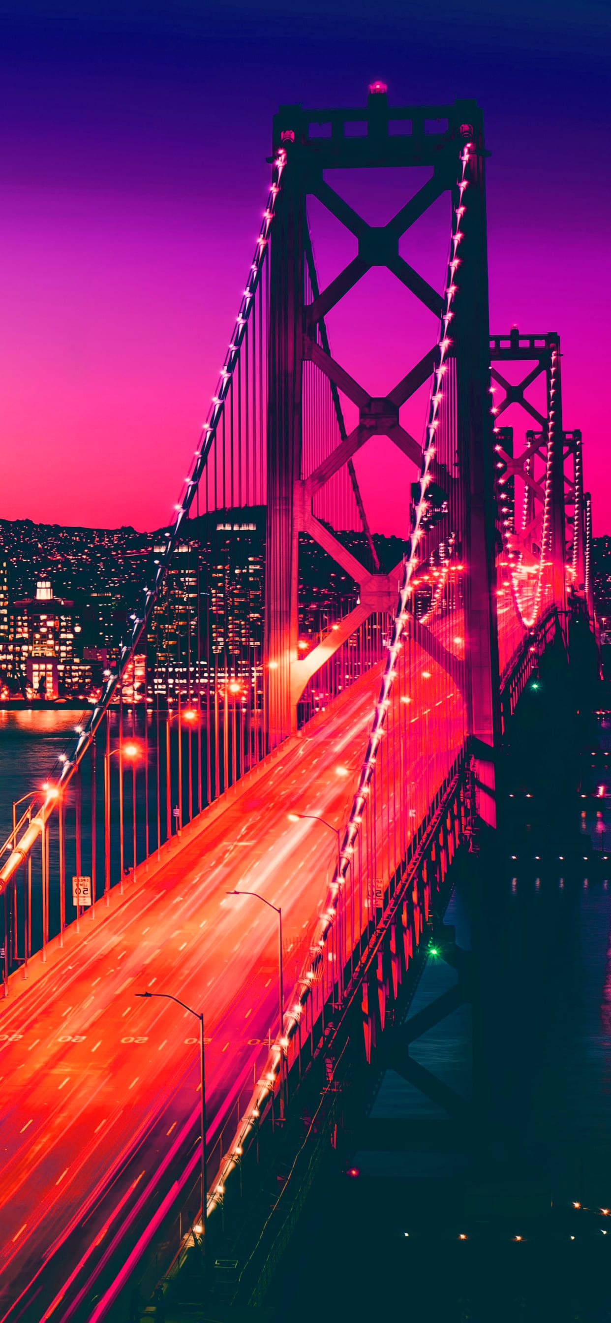 A bridge with cars passing over it at night - California