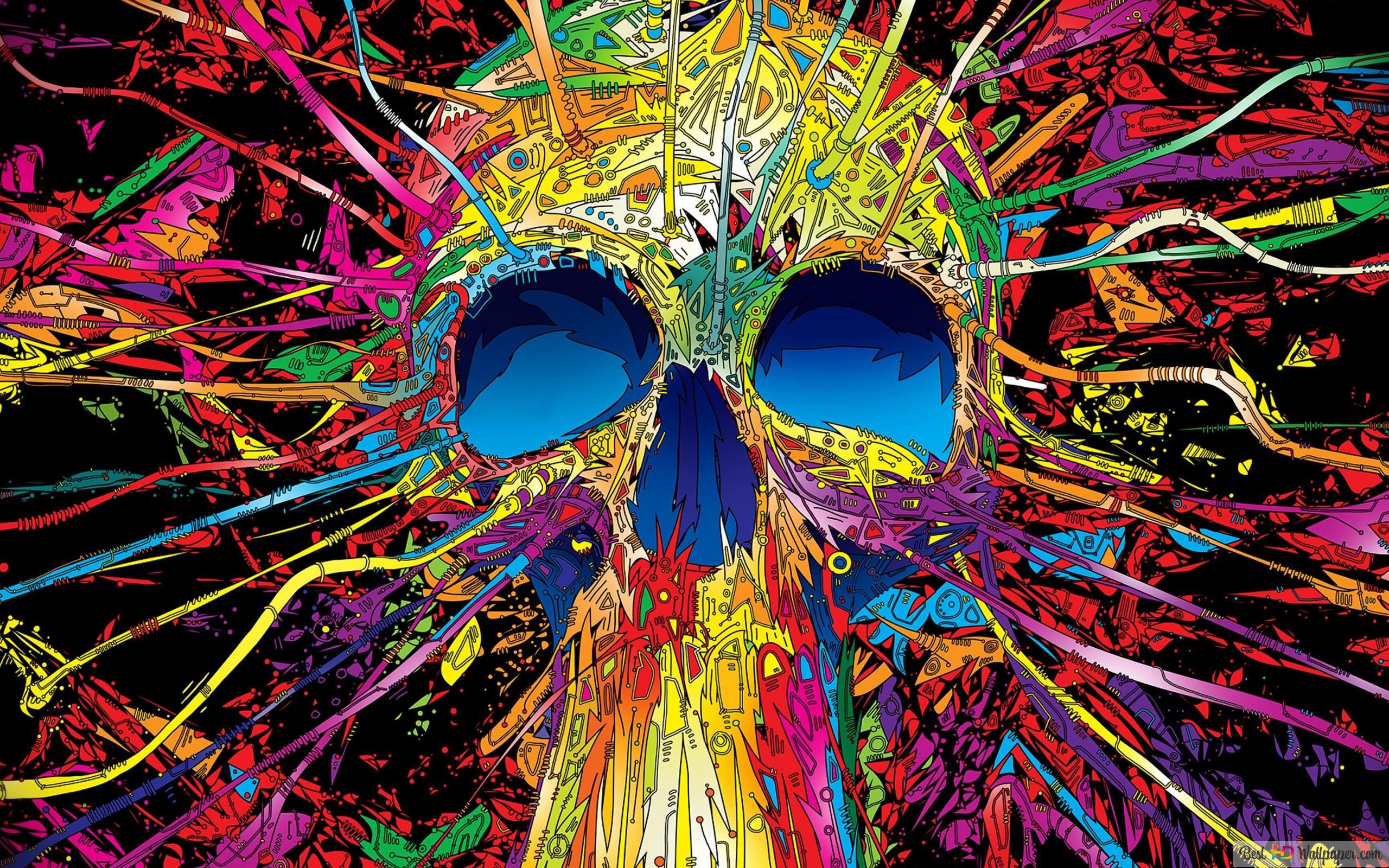 A colorful skull with paint splattered all over it - Skull