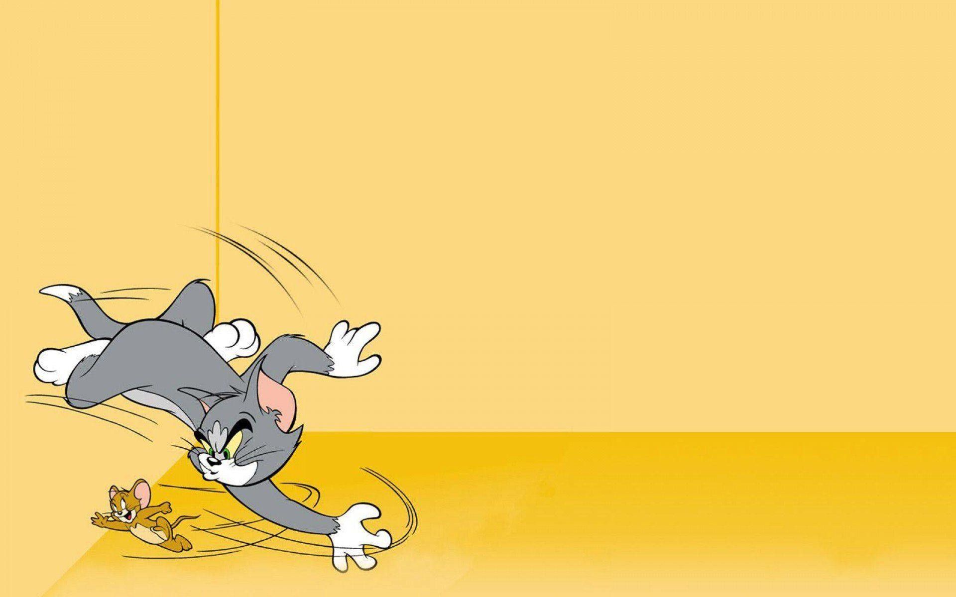 A cartoon cat is falling off the wall - Tom and Jerry