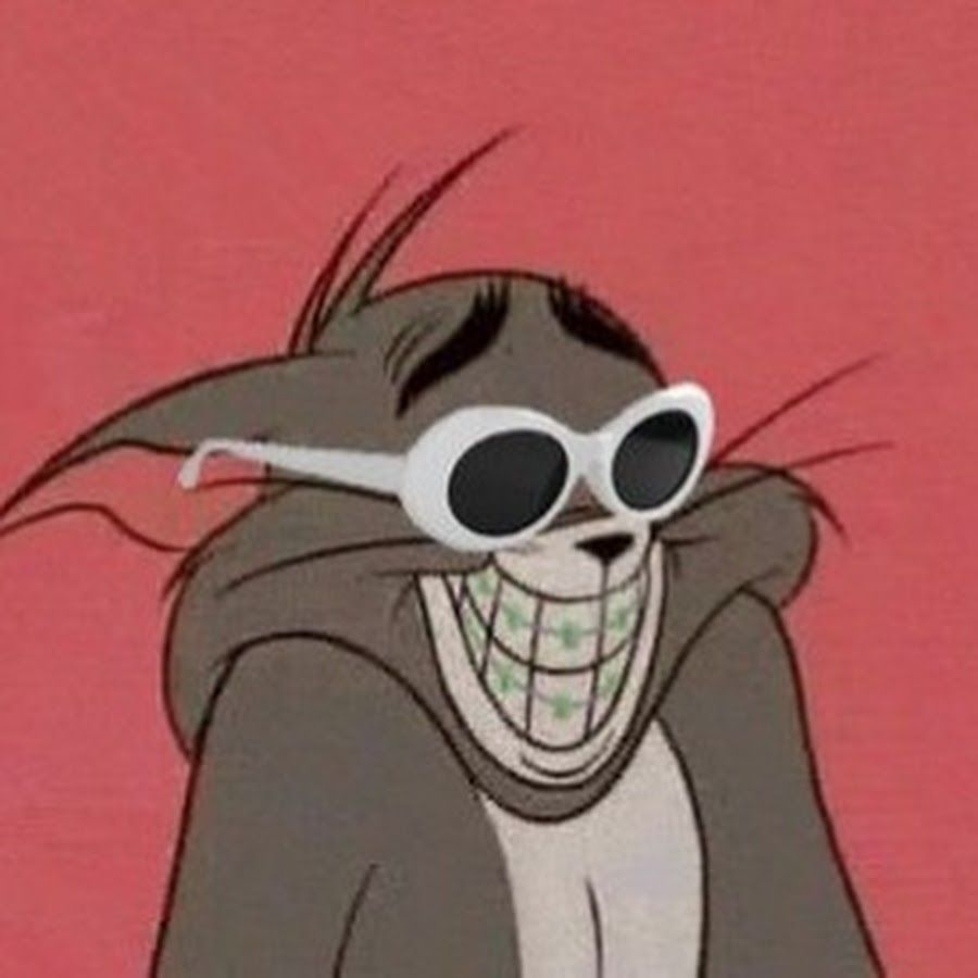 A cartoon cat wearing sunglasses and smiling - Tom and Jerry