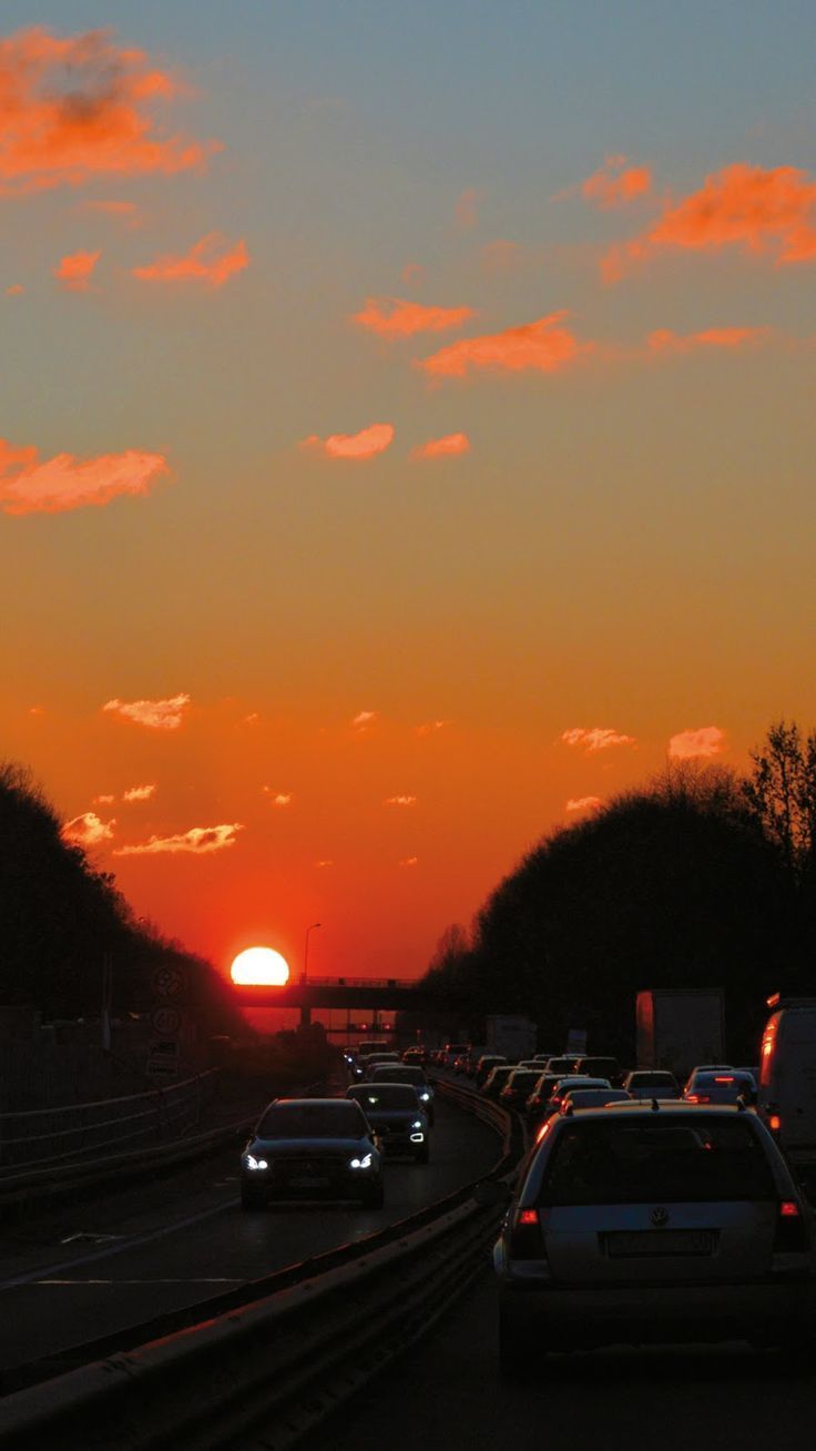 Cars on a highway during a beautiful sunset - Sunrise