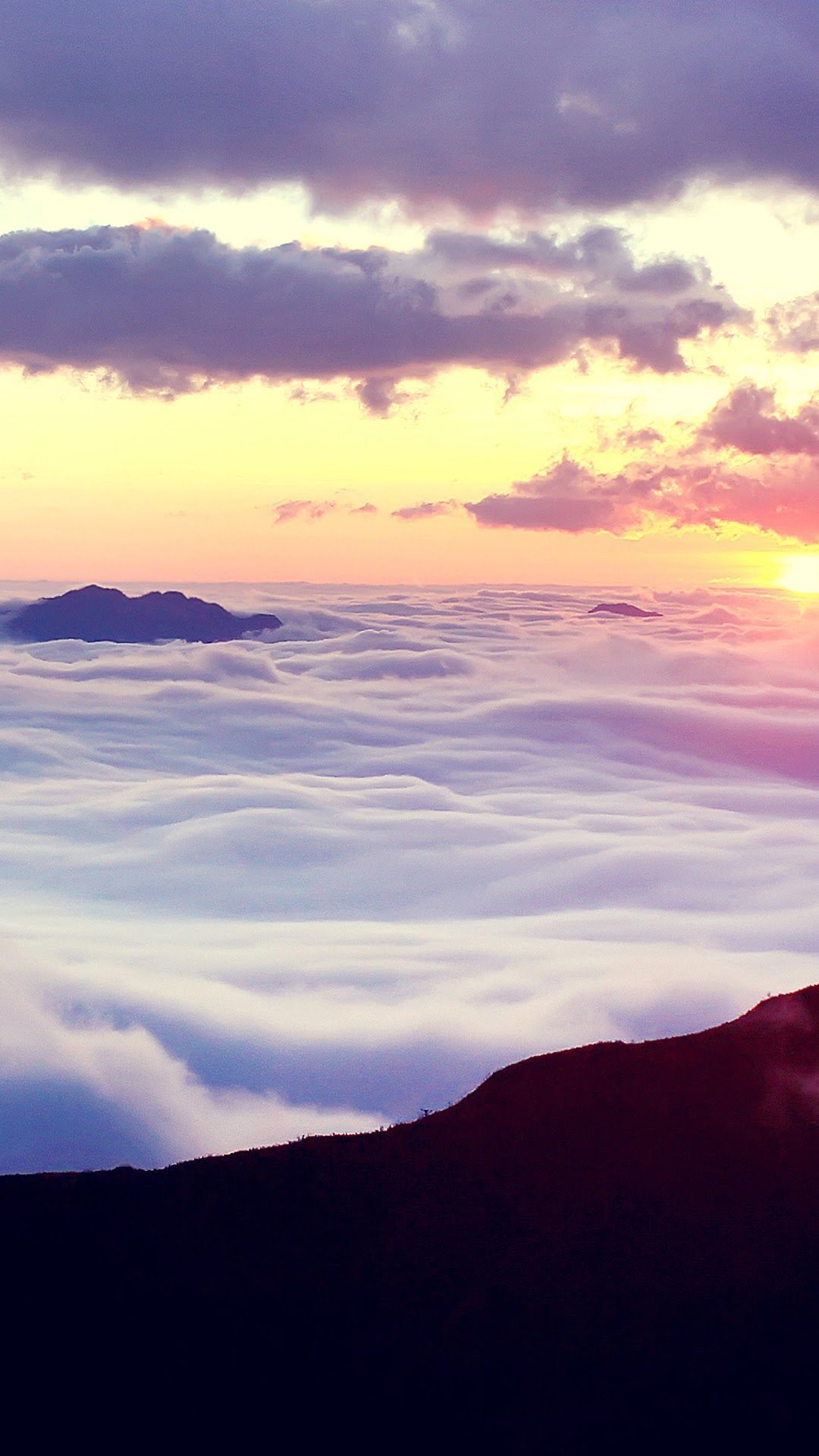 A sunset over the clouds and mountains - Sunrise