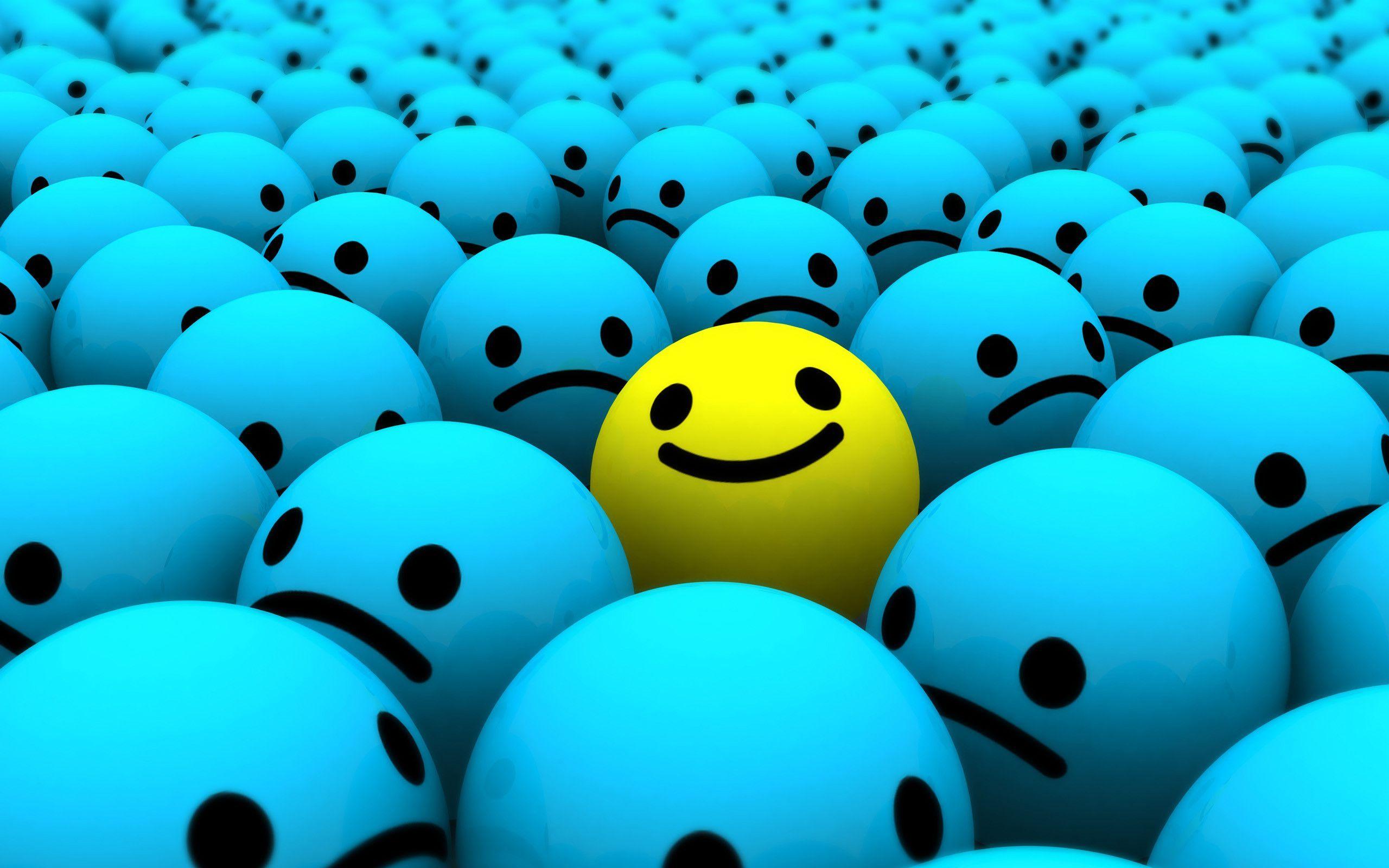 A yellow smiley face in the middle of many blue eggs - Smile