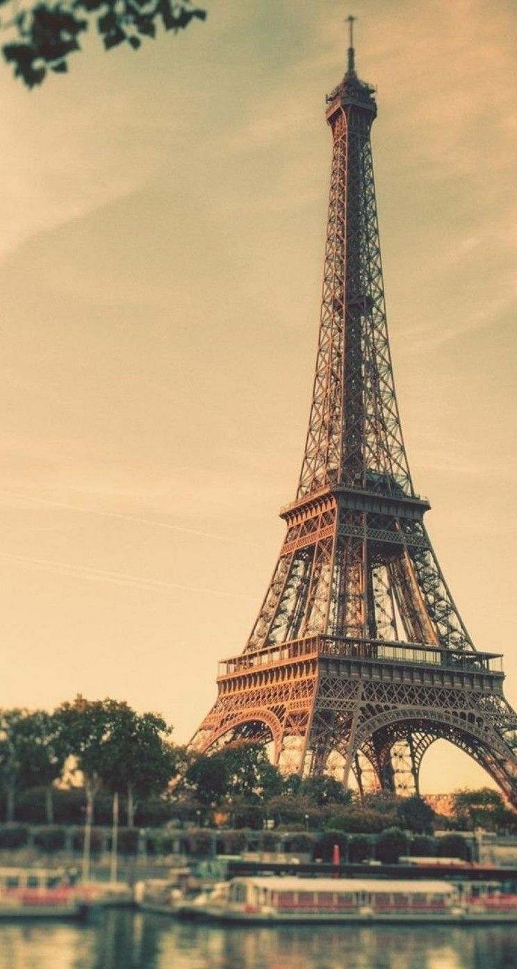 The eiffel tower is seen in a photo - Vintage