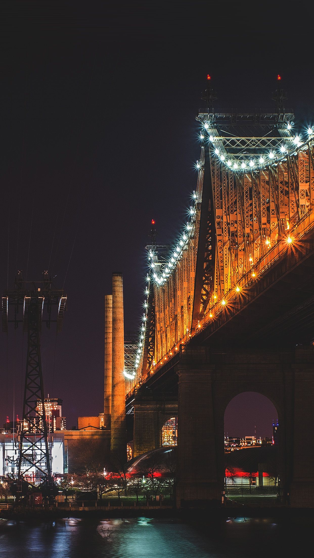 A night time view of the Queensboro Bridge, which connects Long Island City to Roosevelt Island. - City