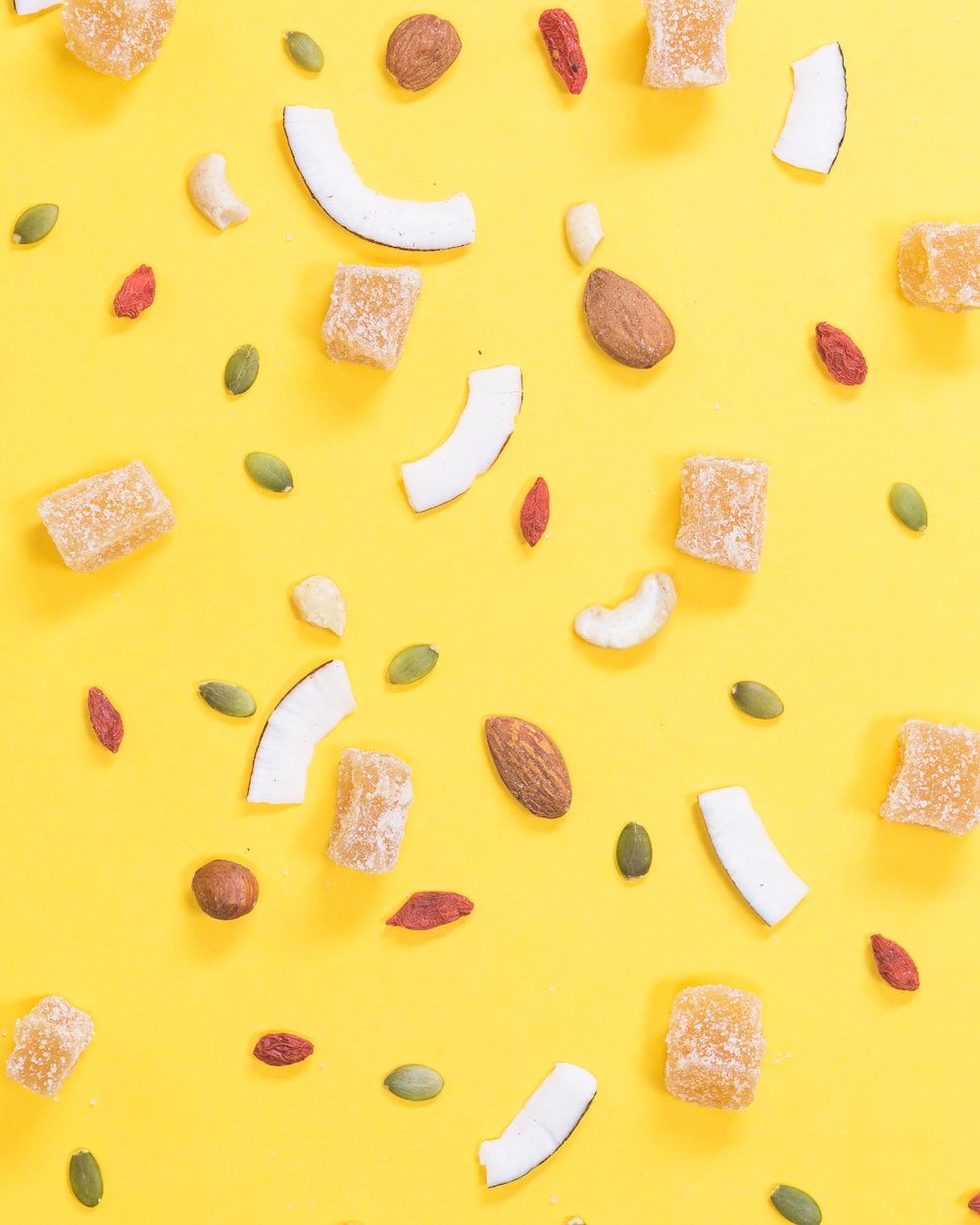 A close up of some candy on yellow - Food, foodie