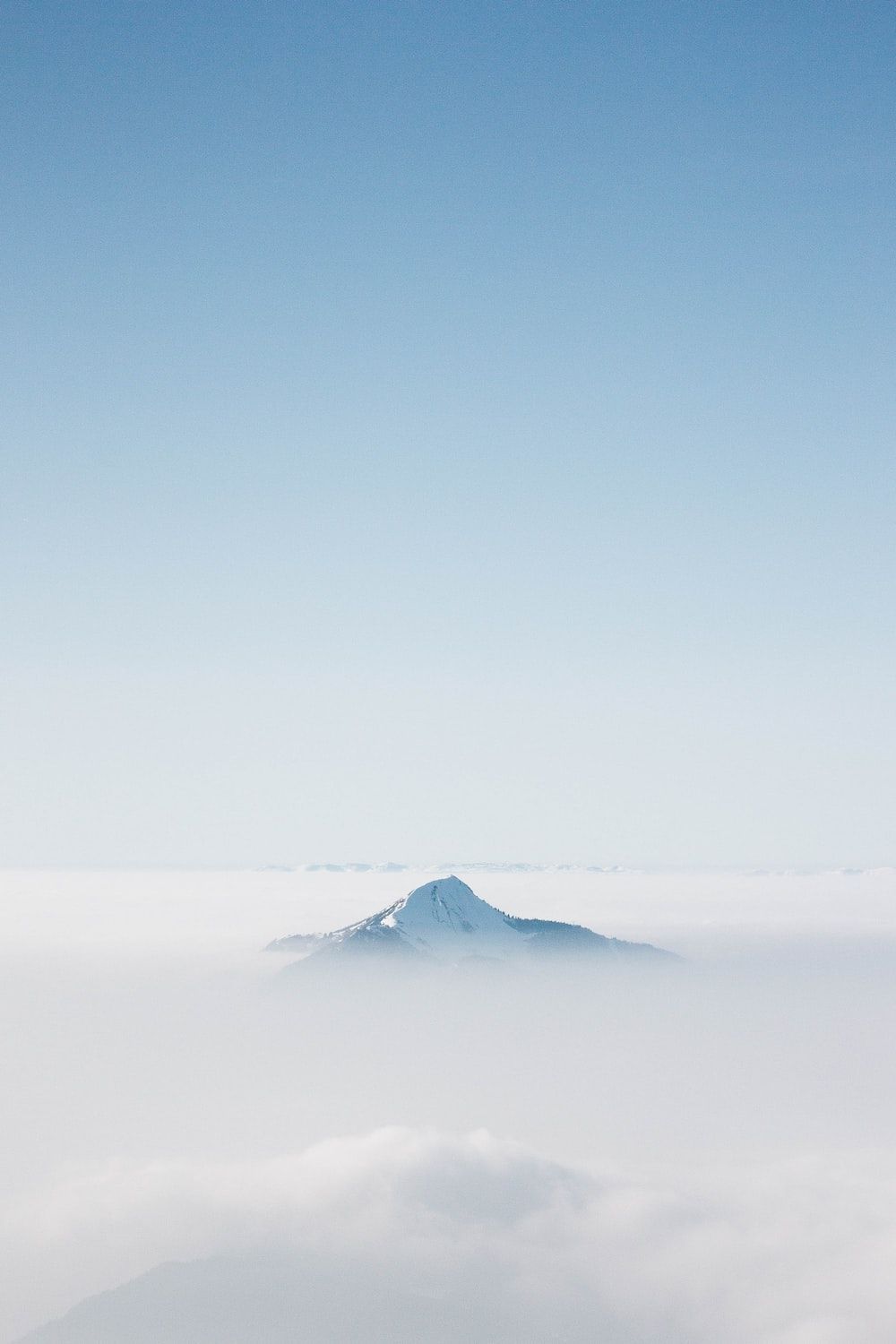 A person is standing on top of the mountain - Blue, pastel blue, dark blue, light blue