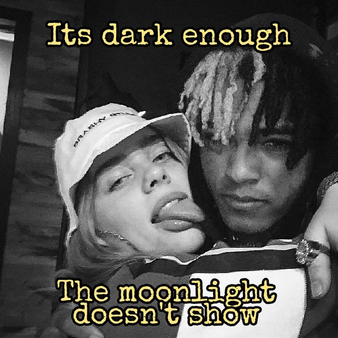 A man and woman are kissing with the words its dark enough - XXXTentacion