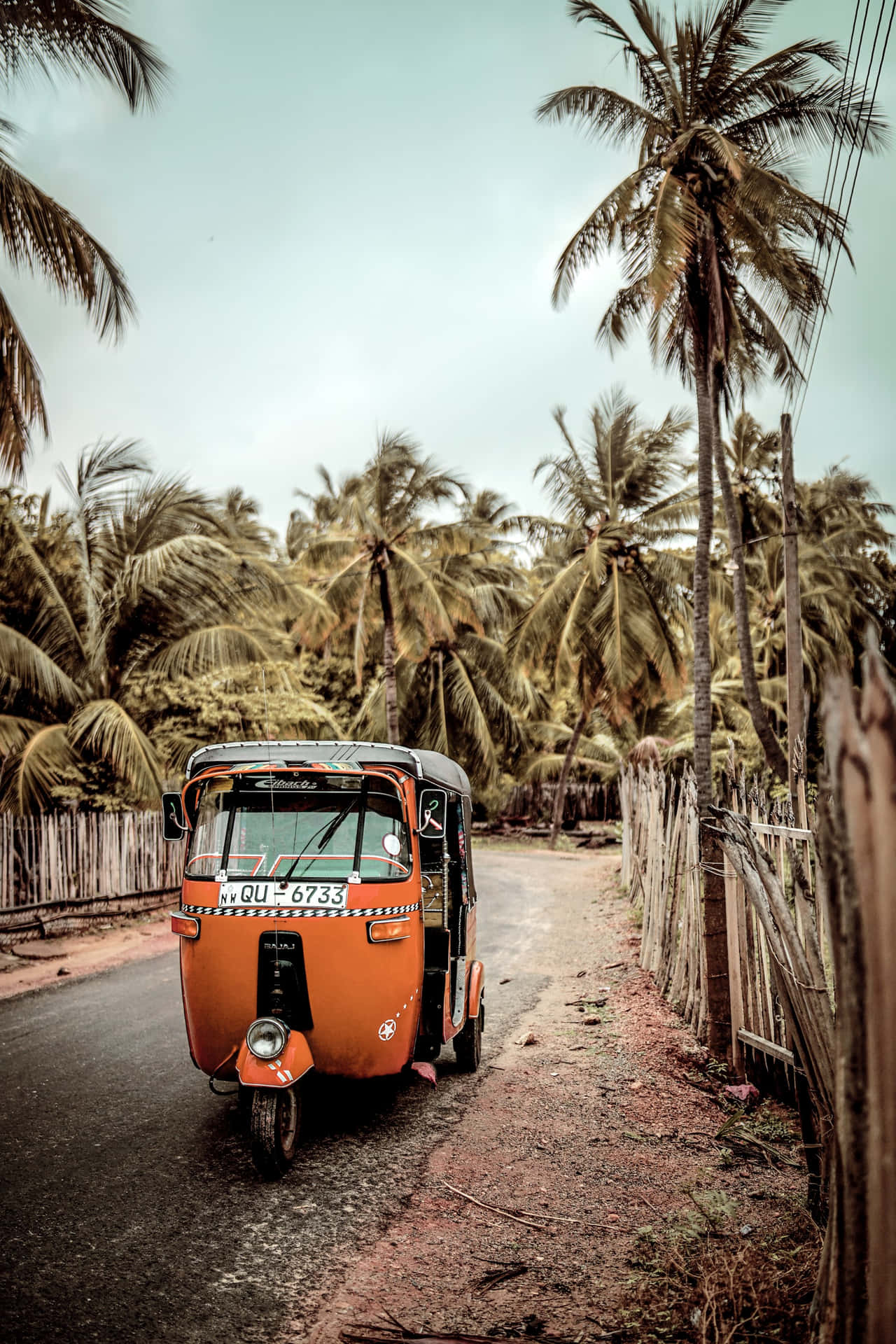 A small vehicle driving down the road - Travel