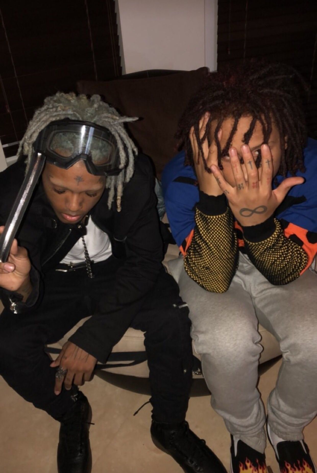 Juice WRLD and Trippie Redd sitting on the floor with their hands on their faces - XXXTentacion