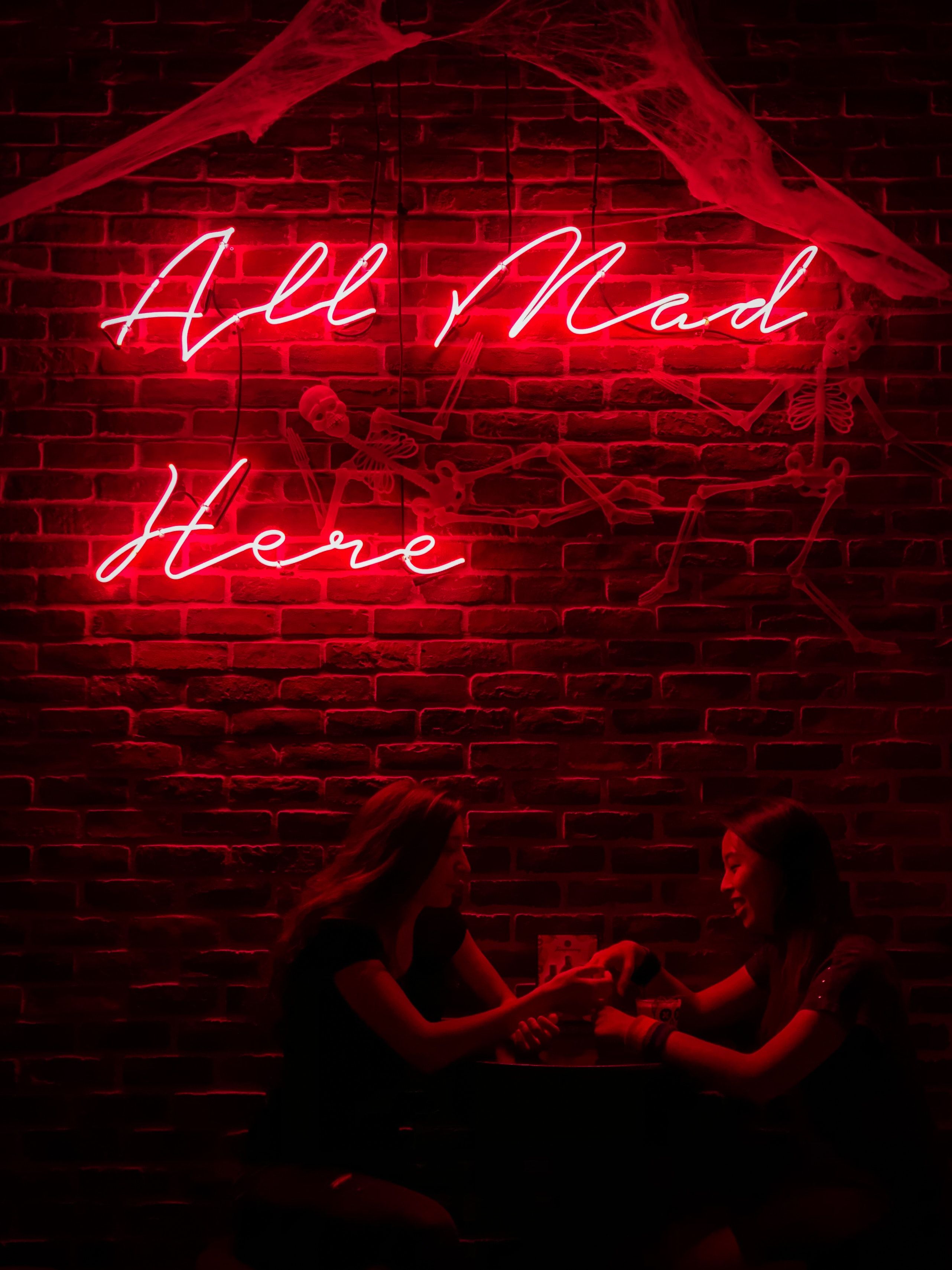 A couple of women sitting at the table - Black, red, sad, dark red, creepy, iPhone red, light red, dark phone, neon red