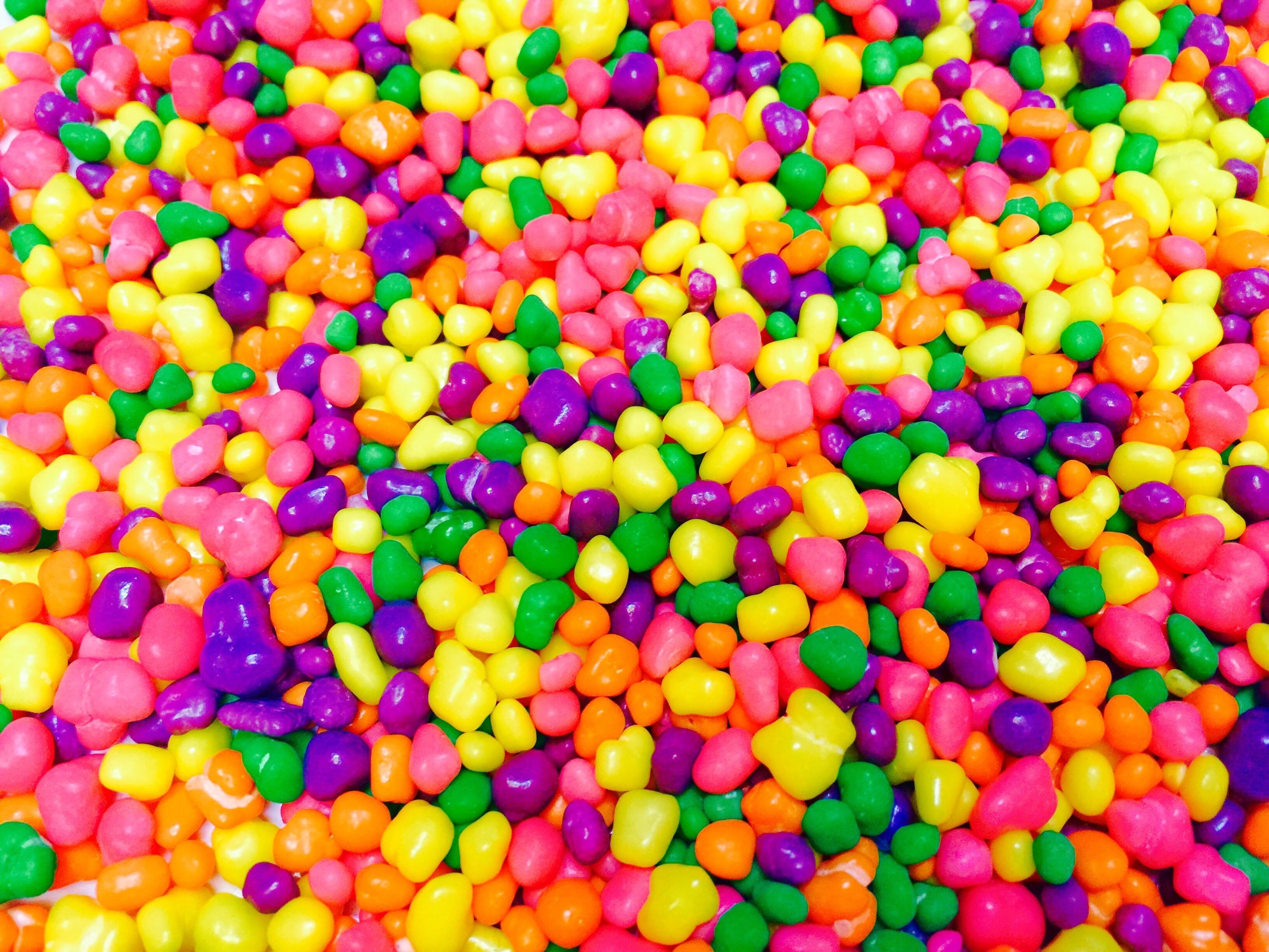 A close up of colorful balls in the shape - Candy