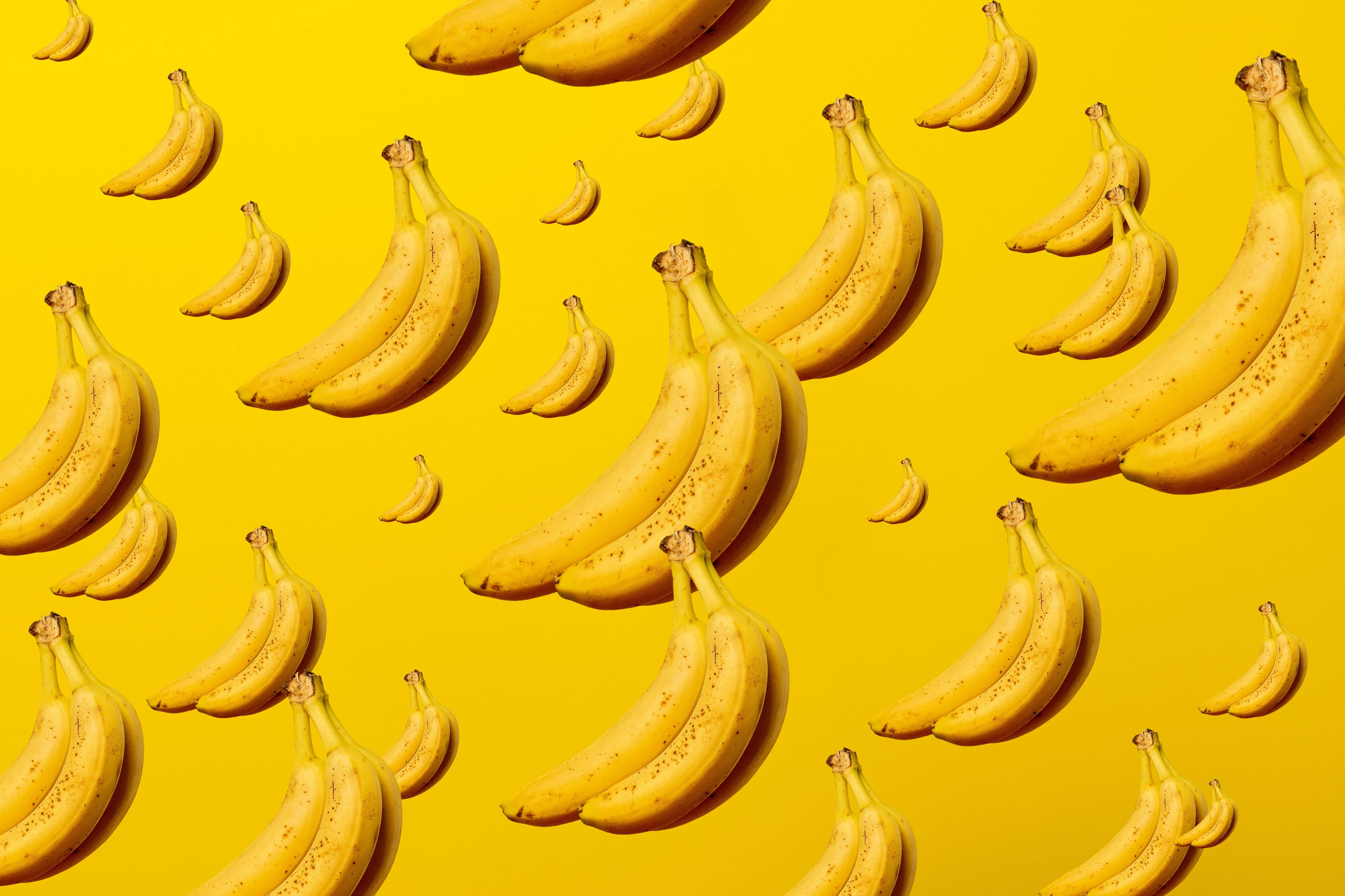 A pattern of bananas on a yellow background - Banana