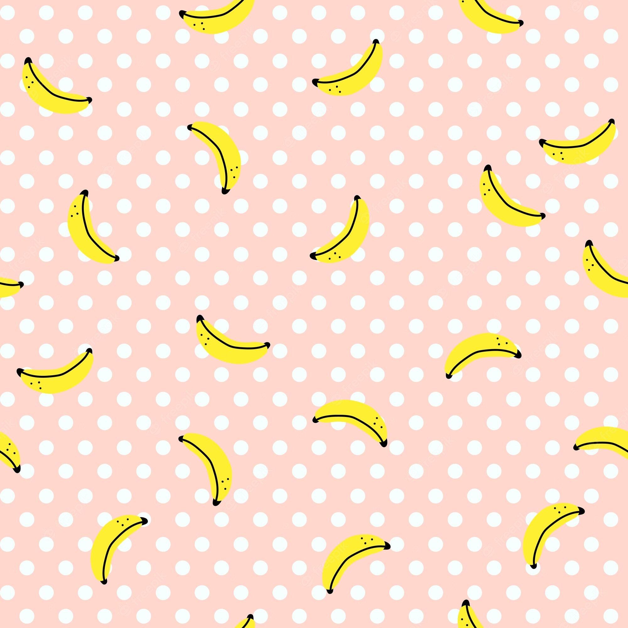 A pink background with white polka dots and yellow bananas - Banana