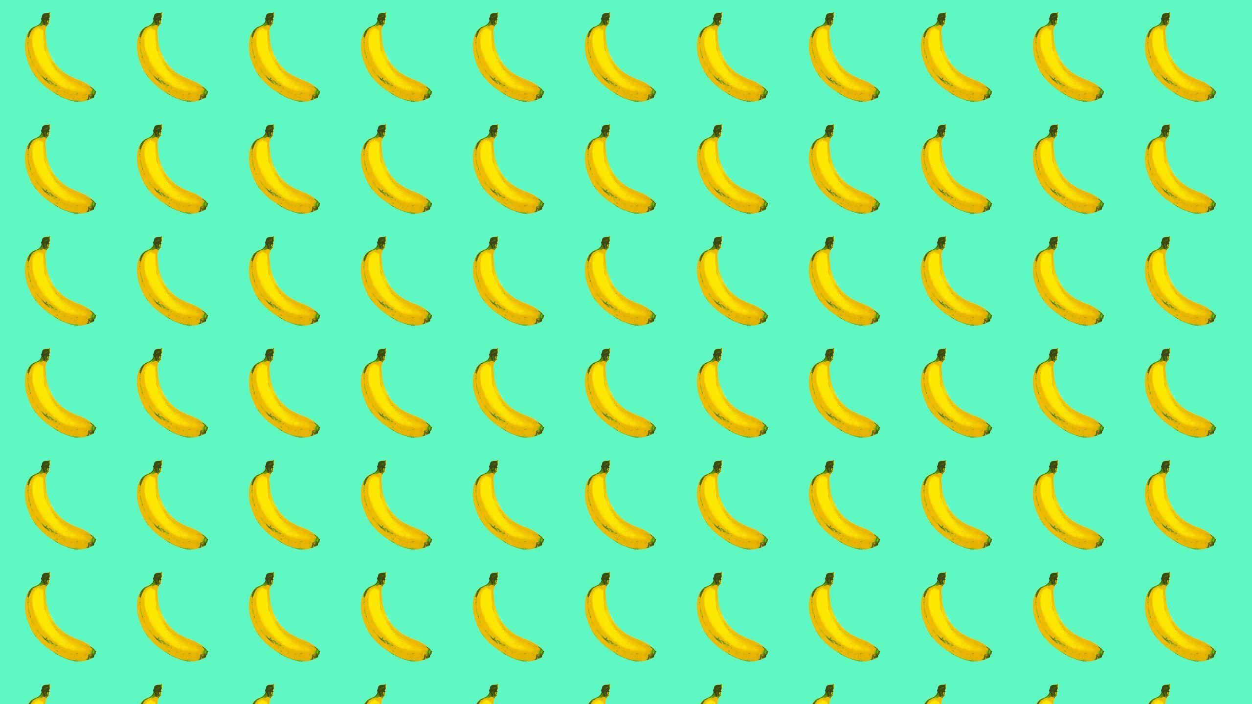 A pattern of bananas on green background - Banana