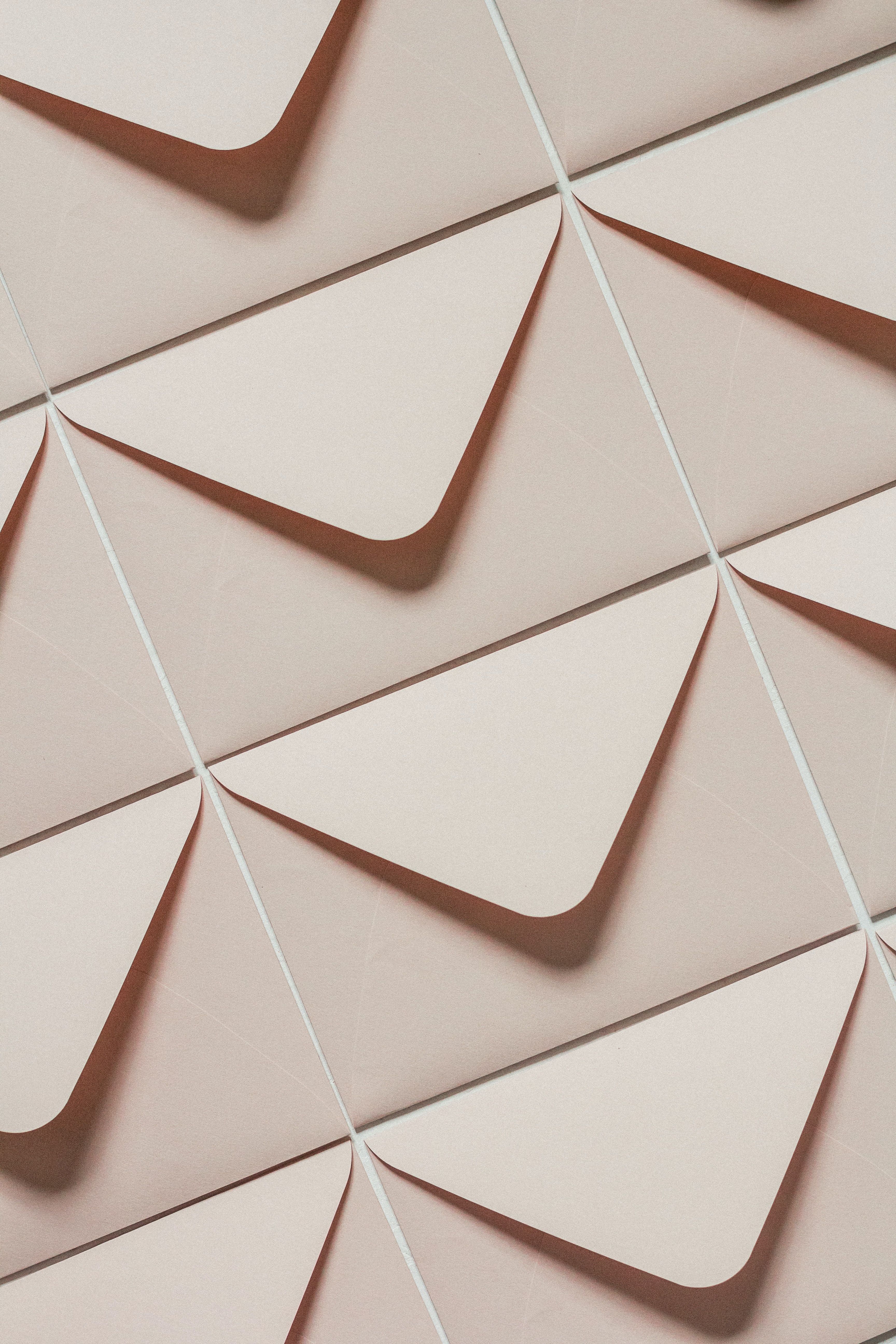 A close up of envelopes on the wall - Beige