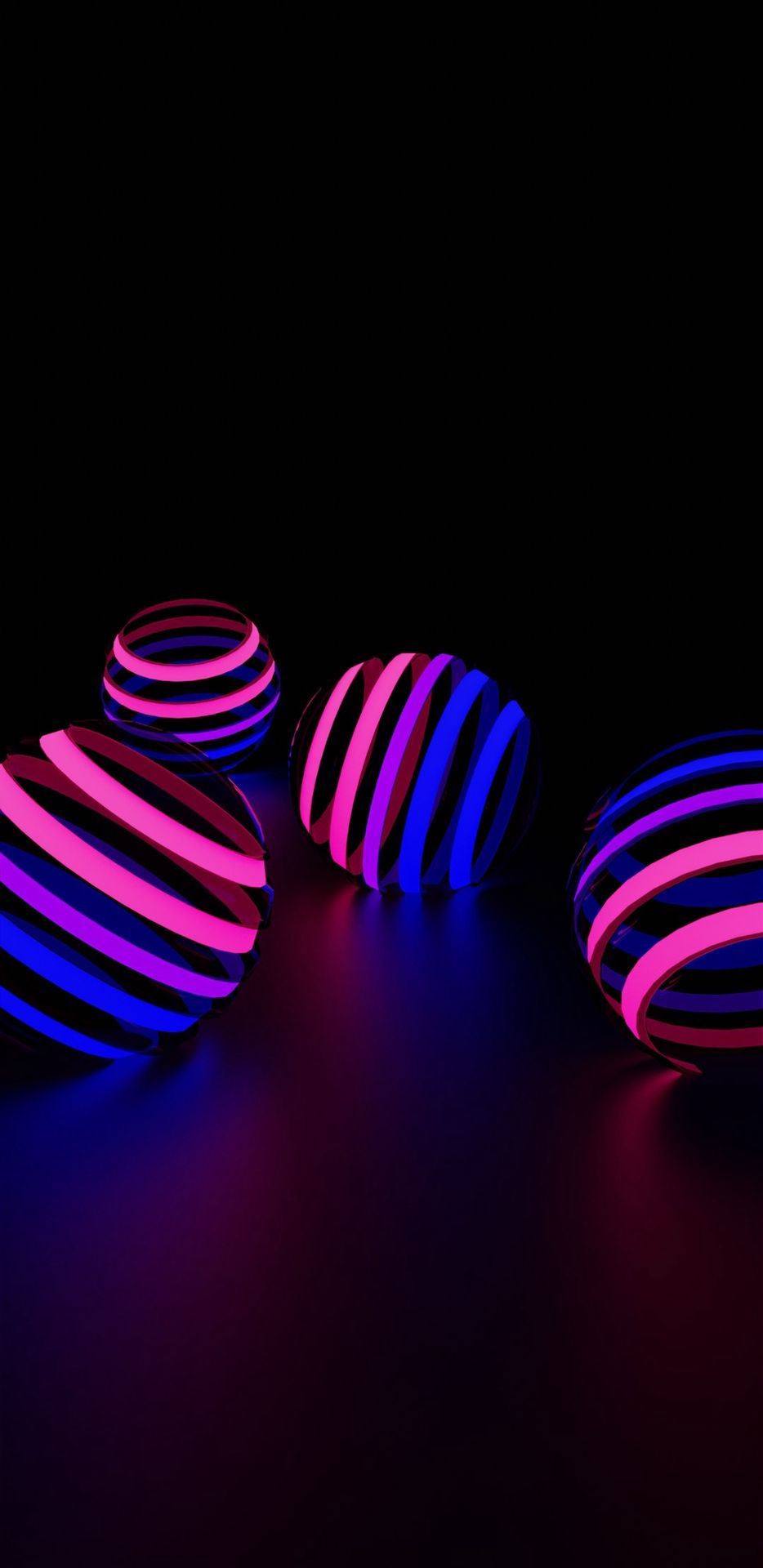 A collection of four 3D spheres with pink and blue lighting. - Bisexual