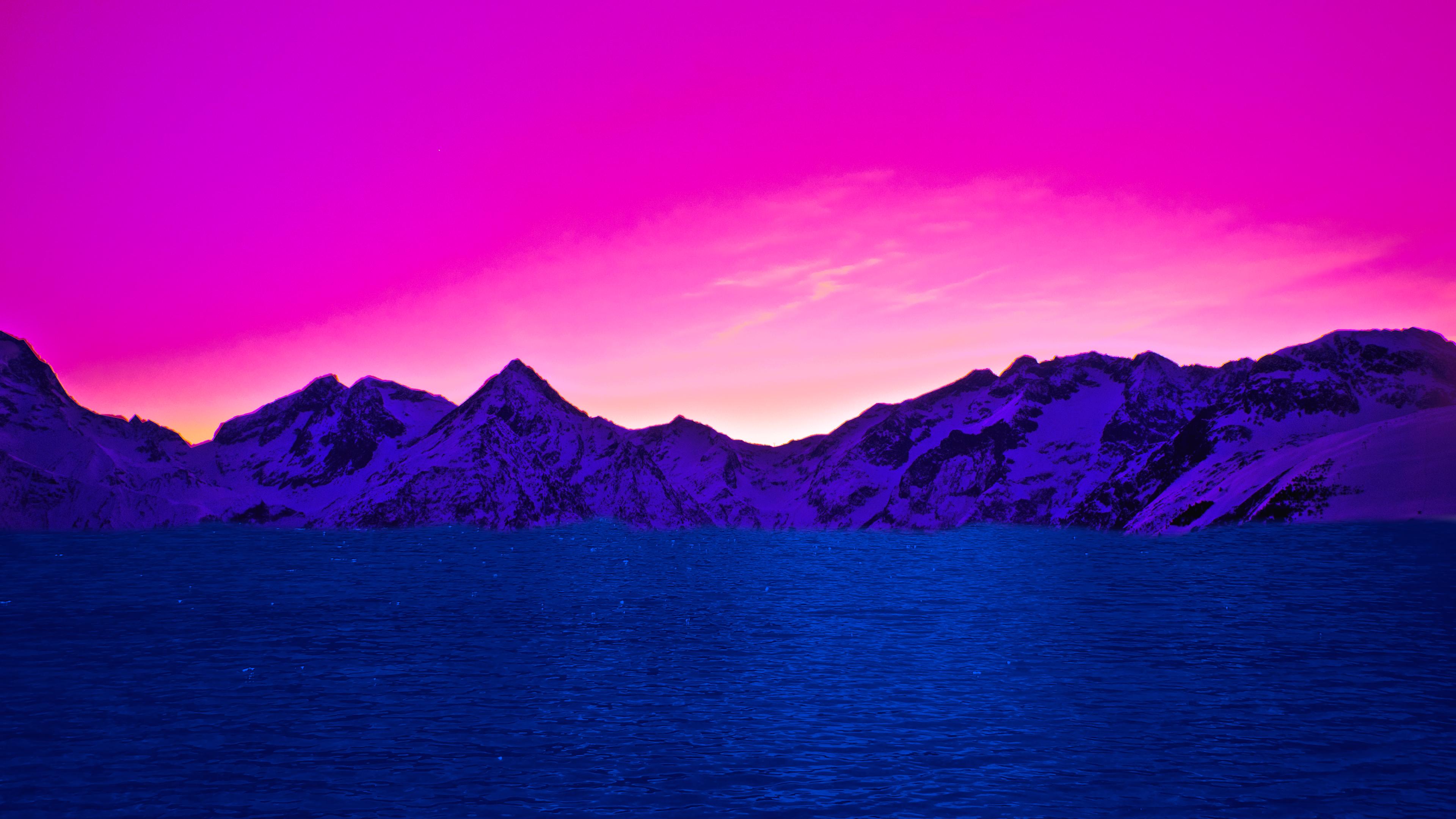 A mountain range with purple and blue sky - Bisexual