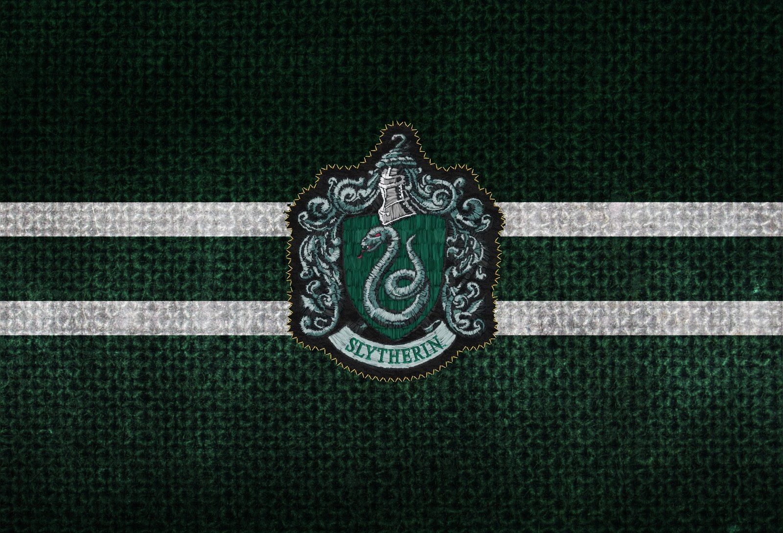 The hogwarts crest on a green background - Slytherin