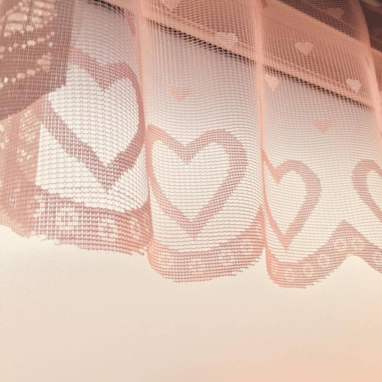 A close up of a curtain with hearts on it - Coquette