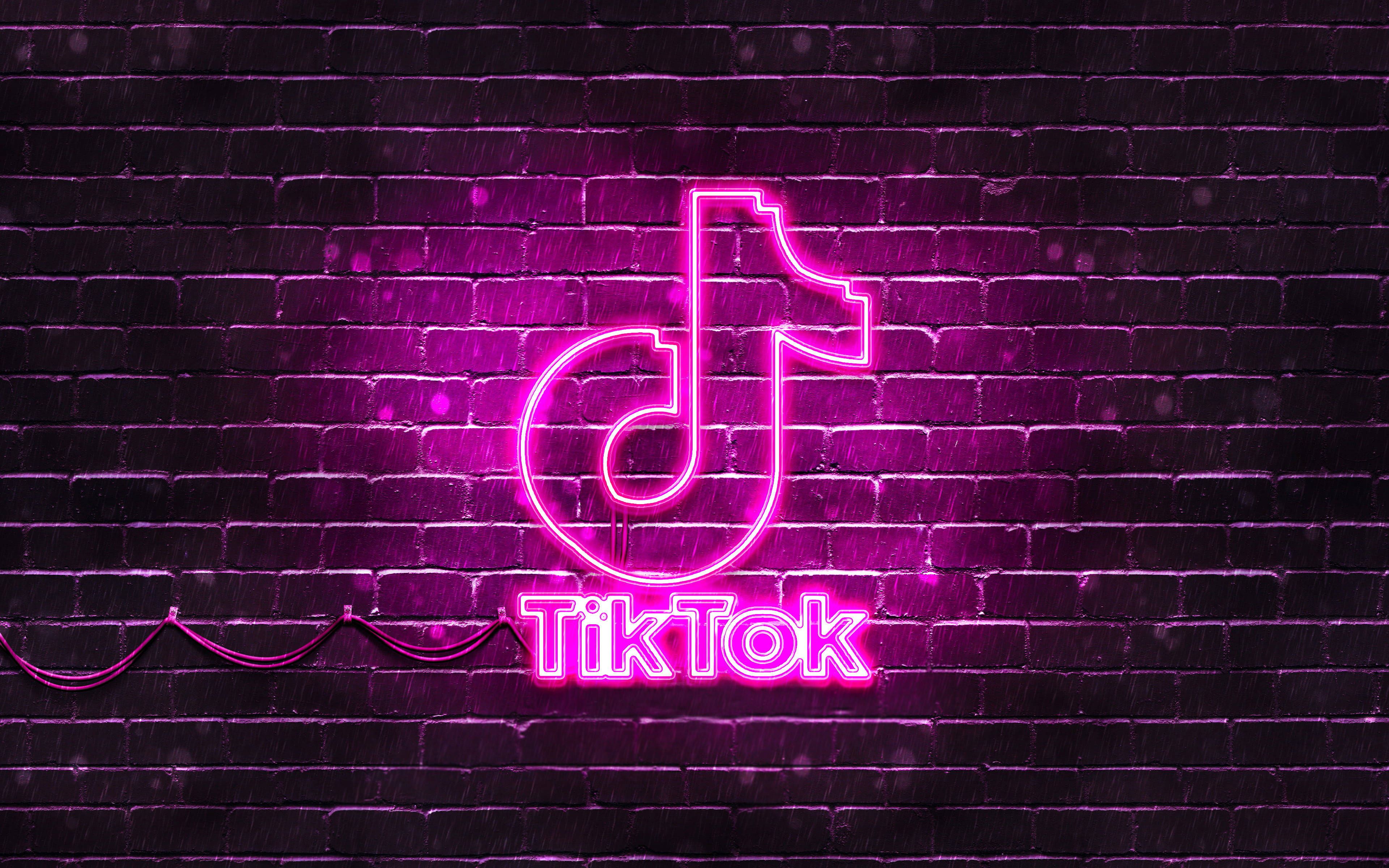 A neon sign with the word tiktok on it - TikTok