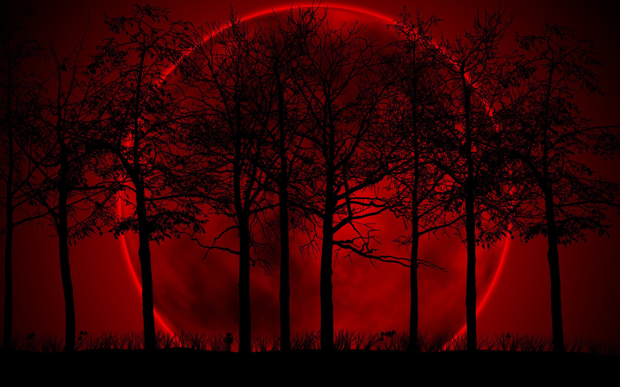 A red moon with trees in the foreground - Blood