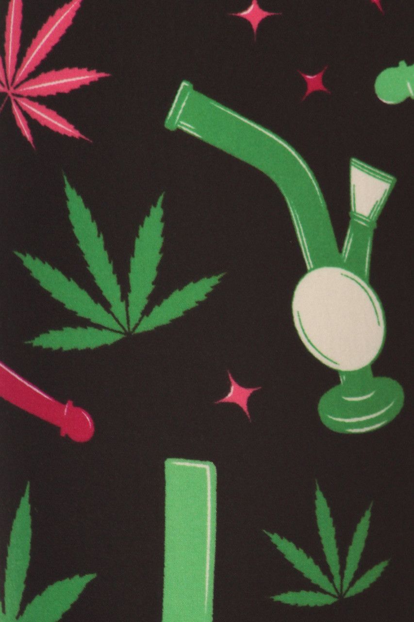 A black background with green and red marijuana leaves - Weed