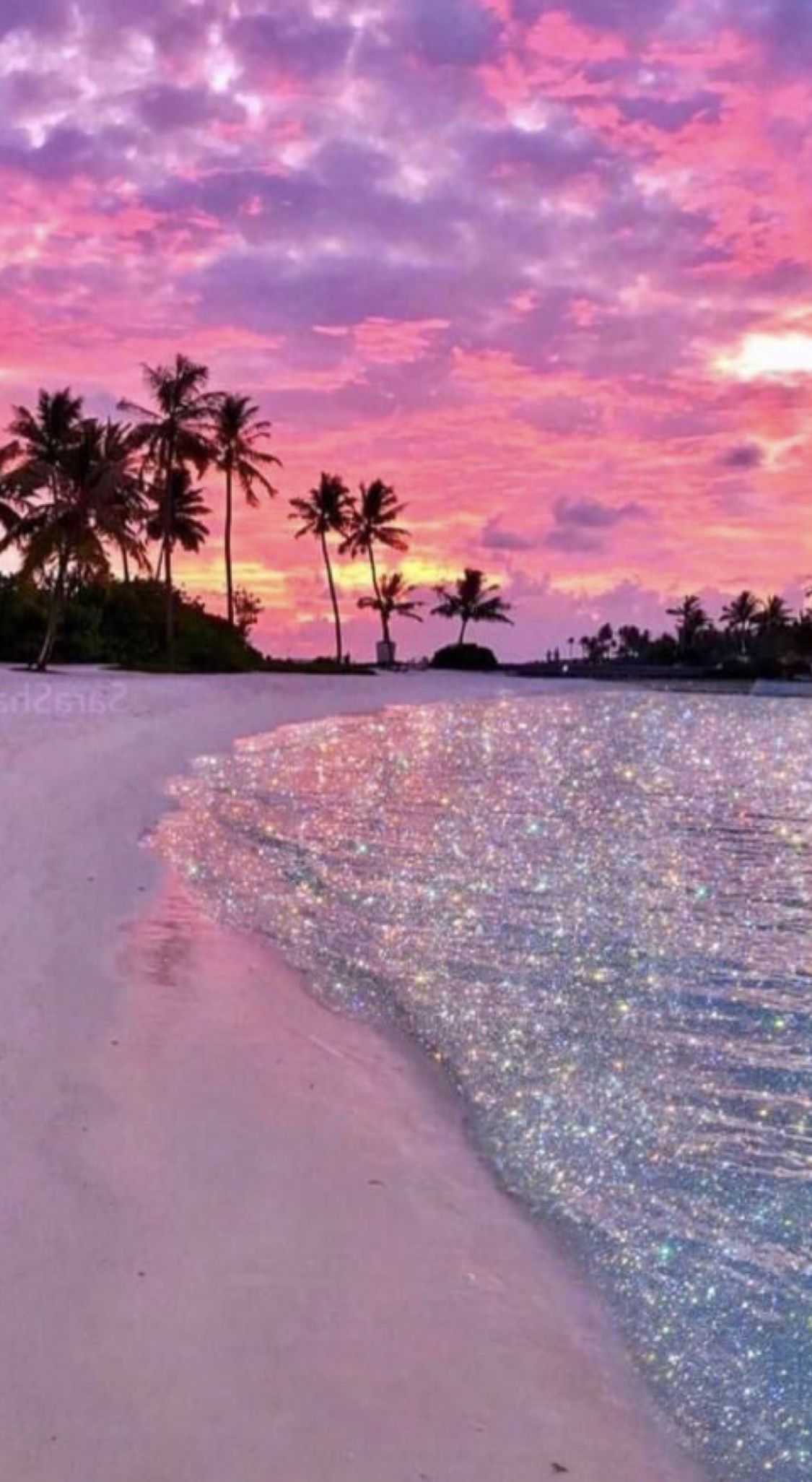 A beach with palm trees and a pink and purple sunset. - Glitter