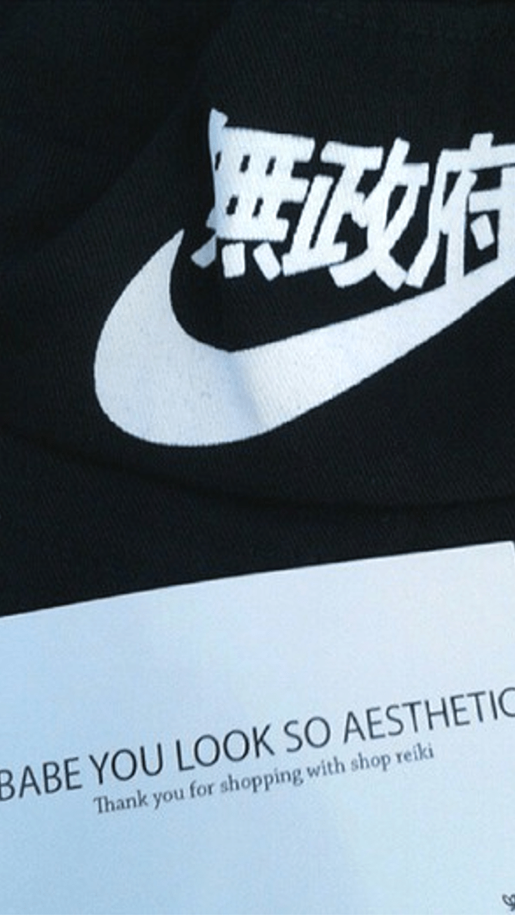 A black shirt with white writing on it - Nike