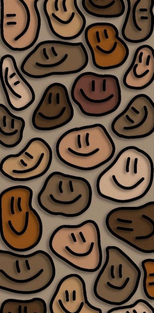 A pattern of smiling faces on rocks - Smile