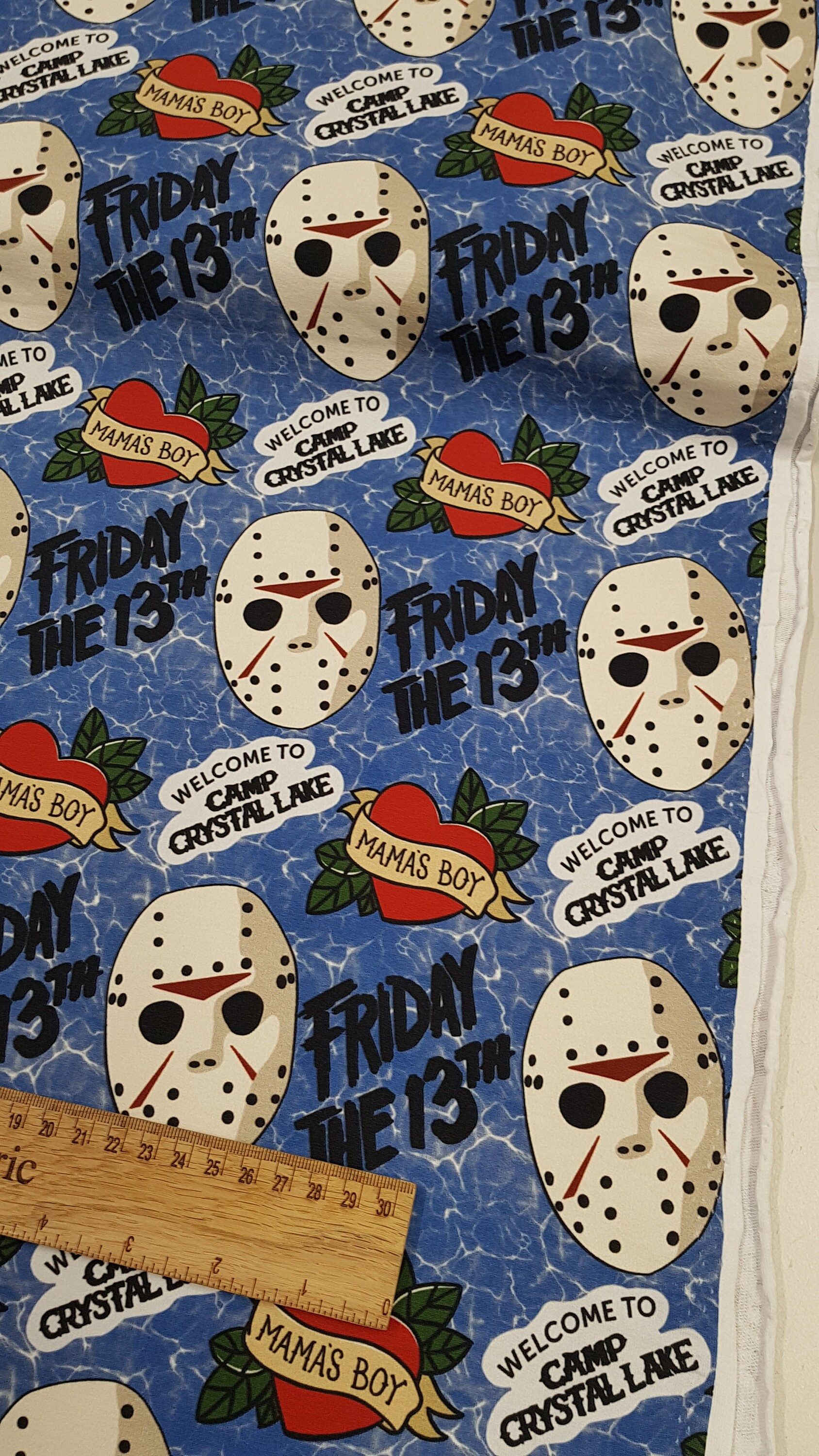 A fabric with friday the 13th masks on it - Horror