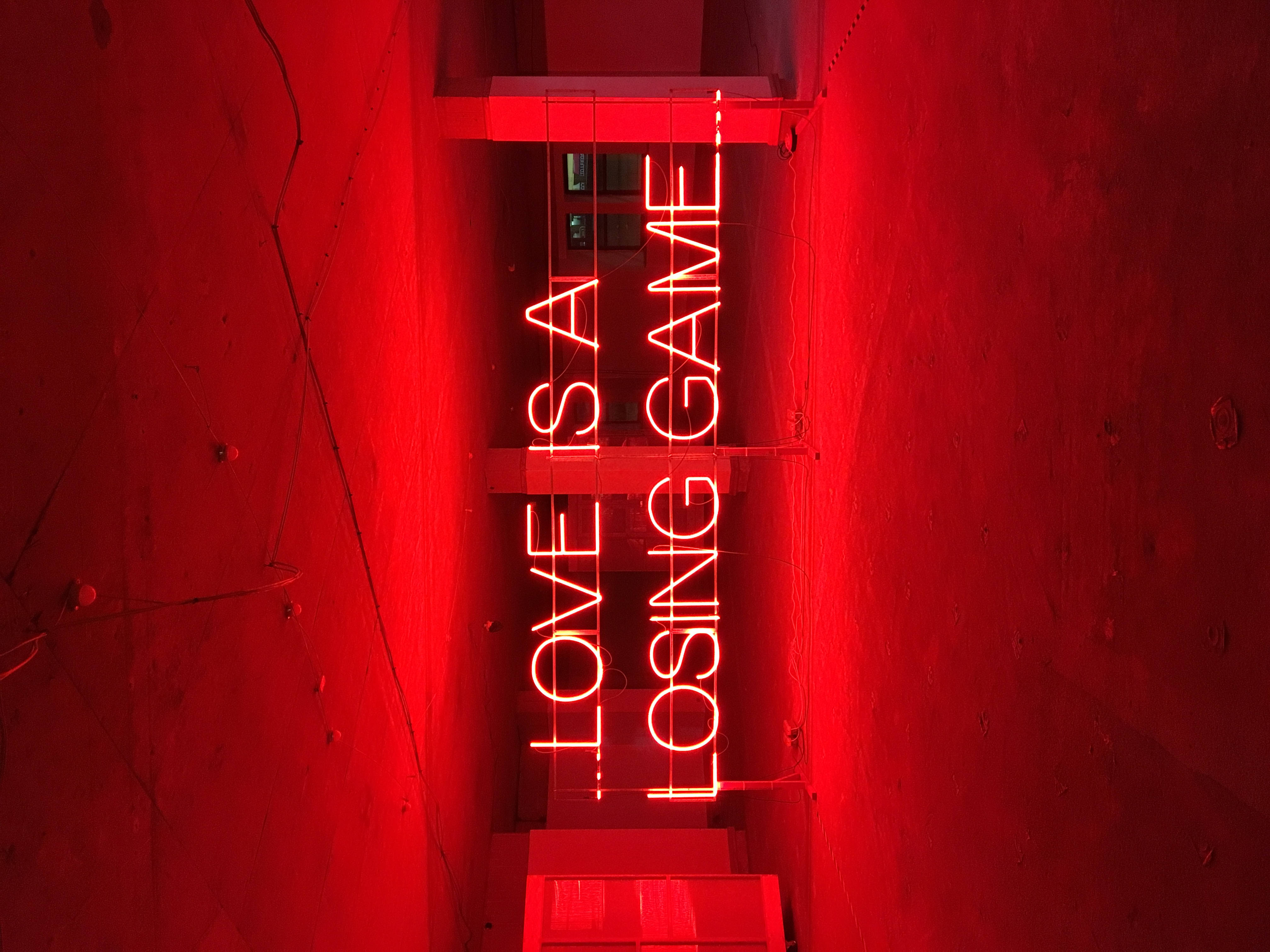 Red neon sign that says 