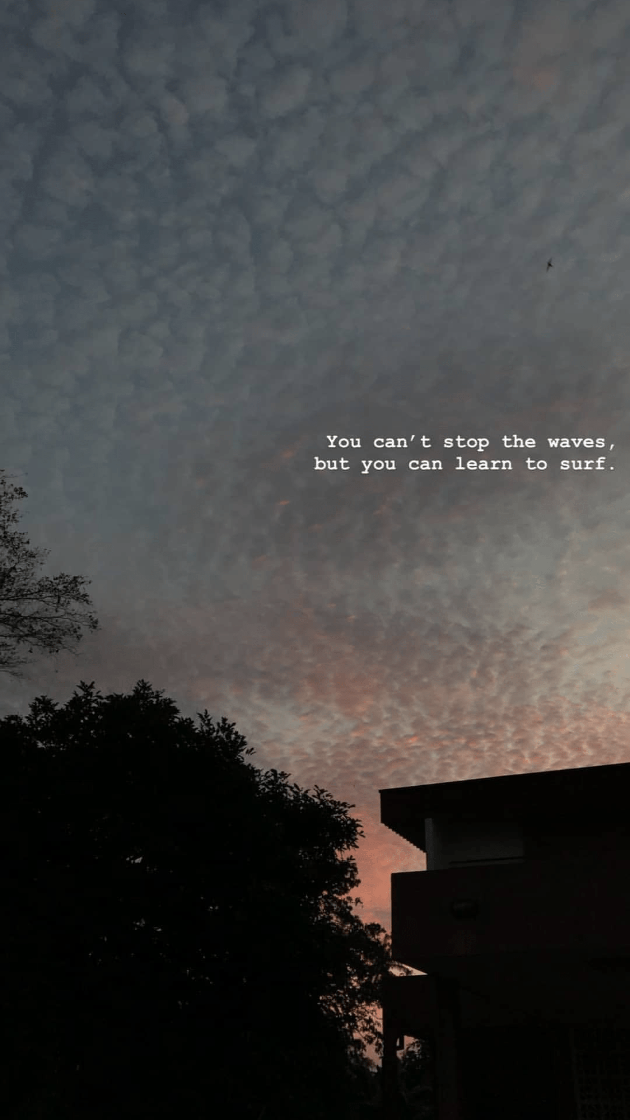 A sunset with clouds and buildings in the background - Sad quotes