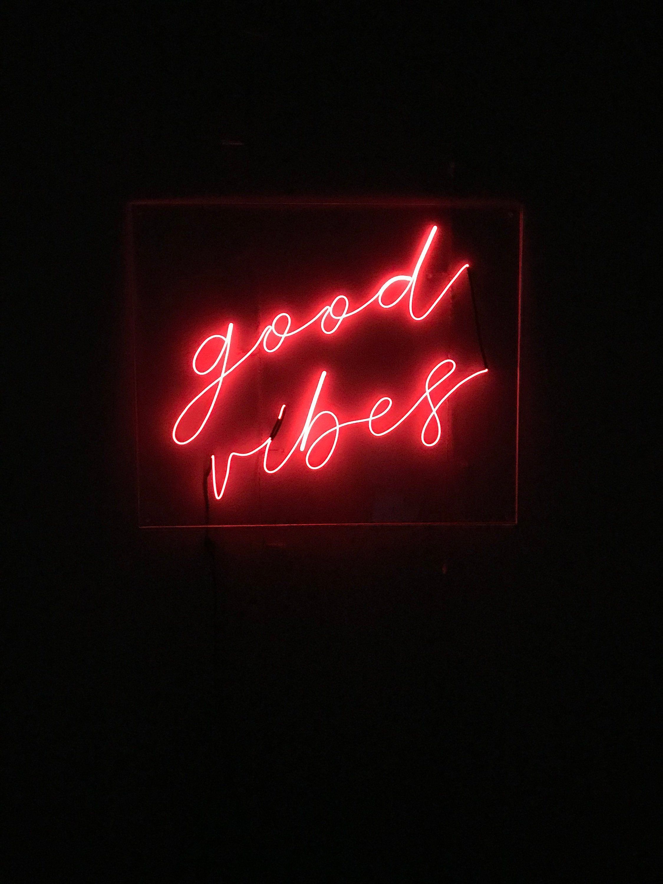 A neon sign that says good vibes - Red, light red, neon red